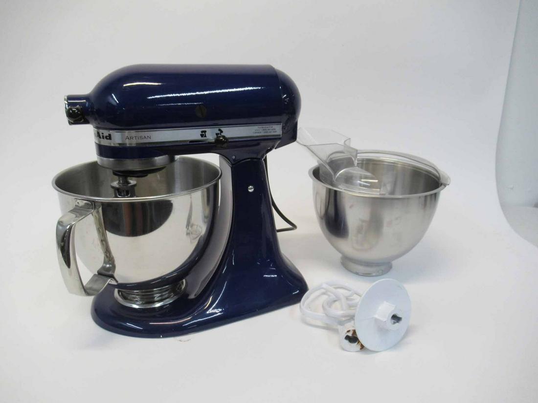 Kitchen Aid Blue Artisan Stand Mixer: Kitchenaid Blue Artisan Stand Mixer including two metal bowls and 3 mixing attachments. Used condition, wear, worn.