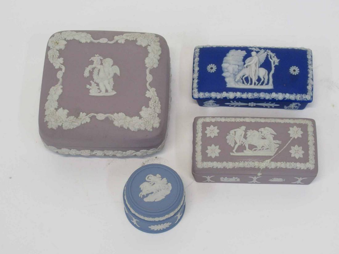 Wedgwood Jasperware Lilac Dresser Box: Wedgwood Jasperware Lilac Dresser Box together with two rectangle dresser boxes and blue pill box. Used condition, cracks, repairs to both rectangle boxes. Largest 4" x 4" x 2"