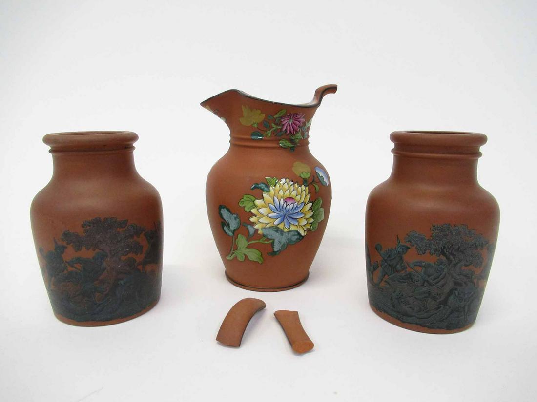 Wedgwood Redware Pitcher: Wedgwood Redware Pitcher with enamel decorated floral design. together with a pair of transfer ware vessels depicting fox and hound hunt. Used condition, handle broken off from redware pitcher and chi