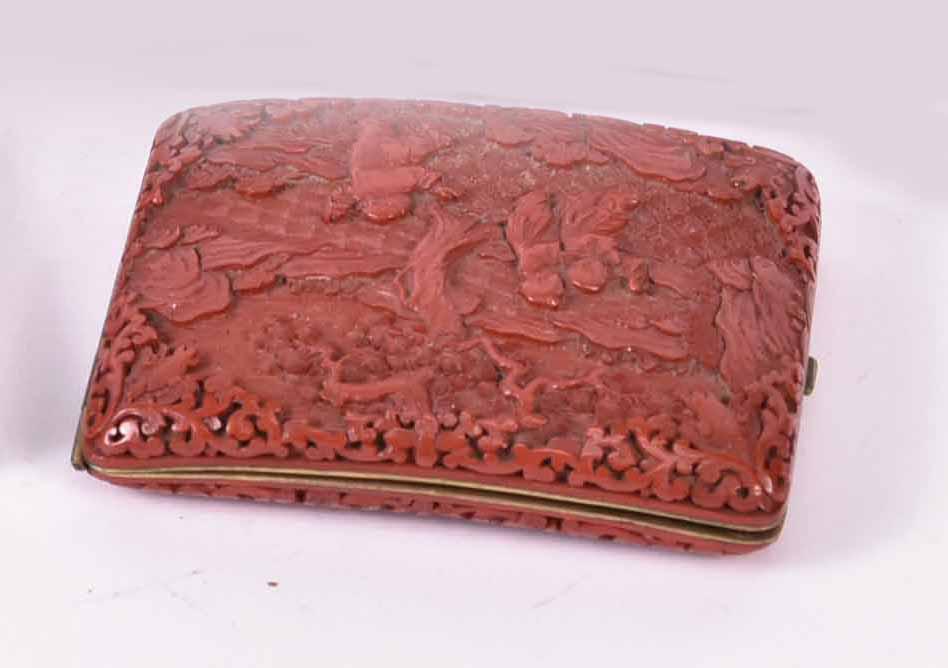 Chinese Cinnabar Curved Cheroot Case: All-over carved figures within landscape, brass interior, C.1860-70, 4-1/4"h x 3-1/3". Provenance: Property from the Collection of Myrna and Bernard Posner Provenance: Quorum Antiques, NYC