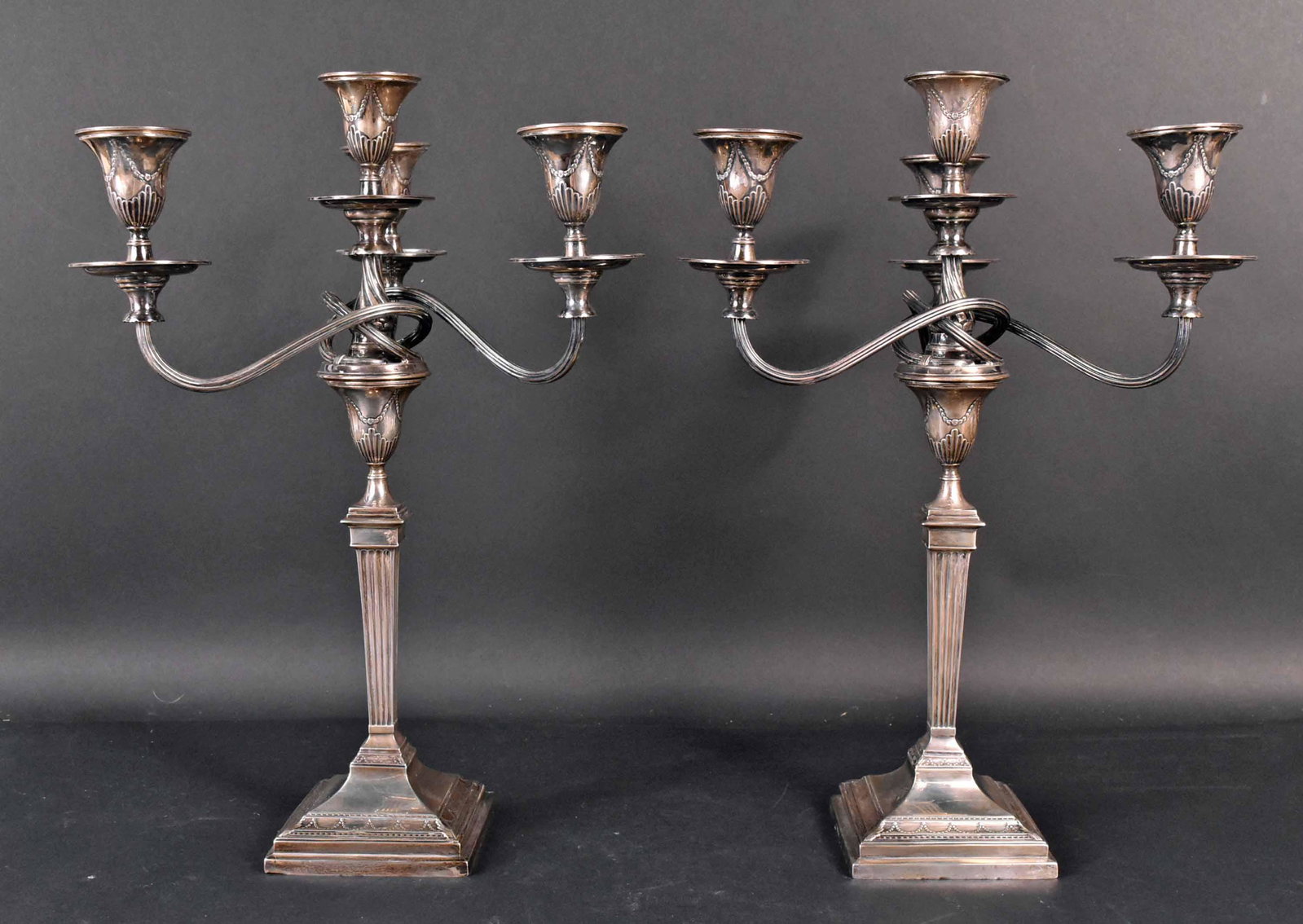 Pair of English Sterling Four-light Candlebra: 20th C. Harrison Brothers and Howson (George Howson mark). Weighted, 19.5"h x 13"dia.