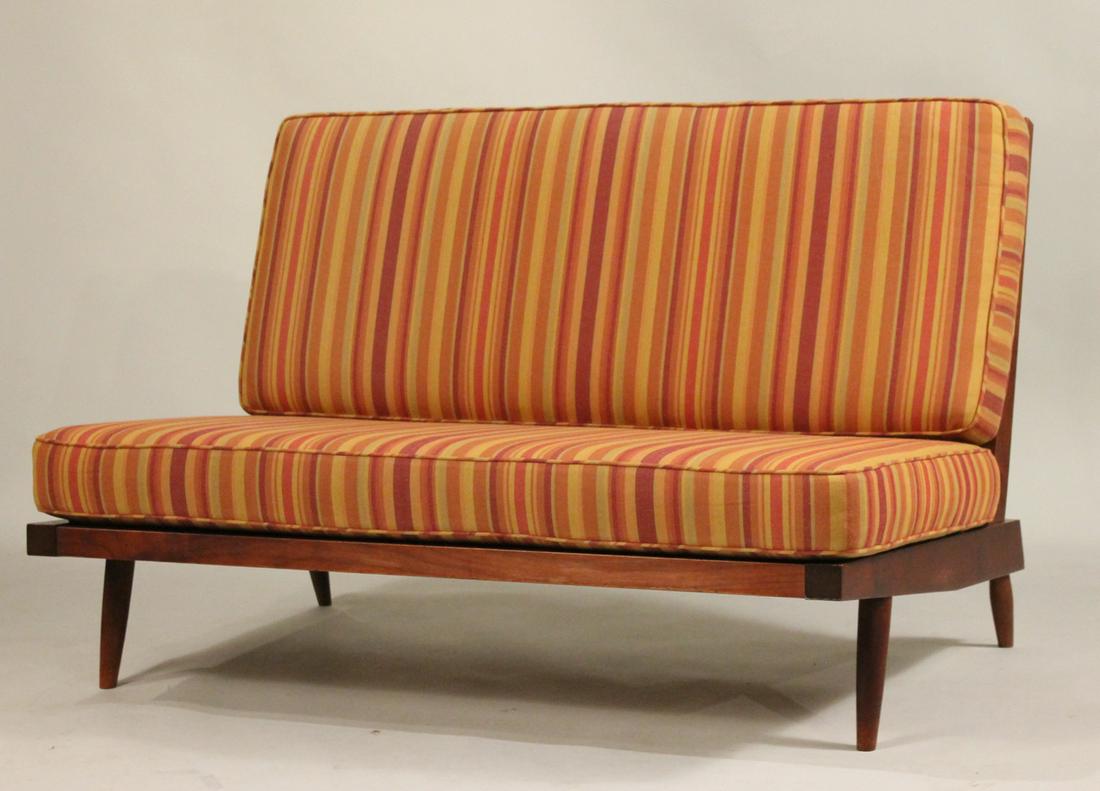George Nakashima Walnut Settee: (1905-1990) Nakashima Studio, with copy of original receipt, armless, spindle back, with two loose fitted cushions. 31"h x 4'w x 34"d Provenance: The Collection of the Estate of Elayne and Monroe Wein