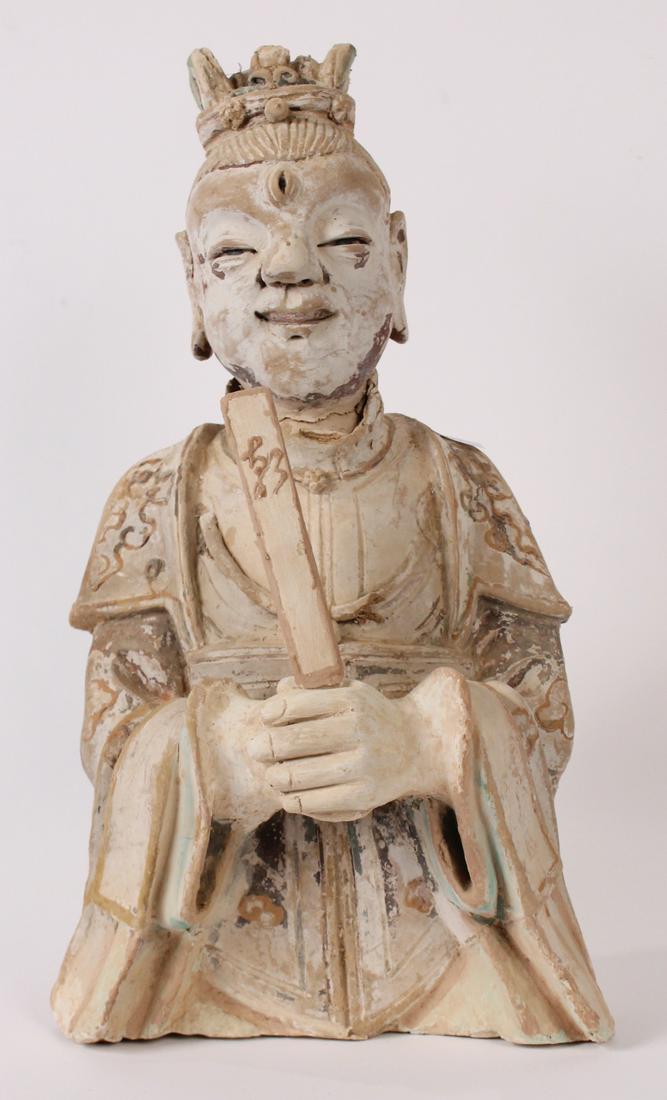 Chinese Painted Pottery Figure of an Immortal: Tang Dynasty (618-907), the standing figure with serene countenance, folded hands holding a plaque, and dressed in flowing robes decorated with swirling ruyi clouds, with an ornate headdress, traces o