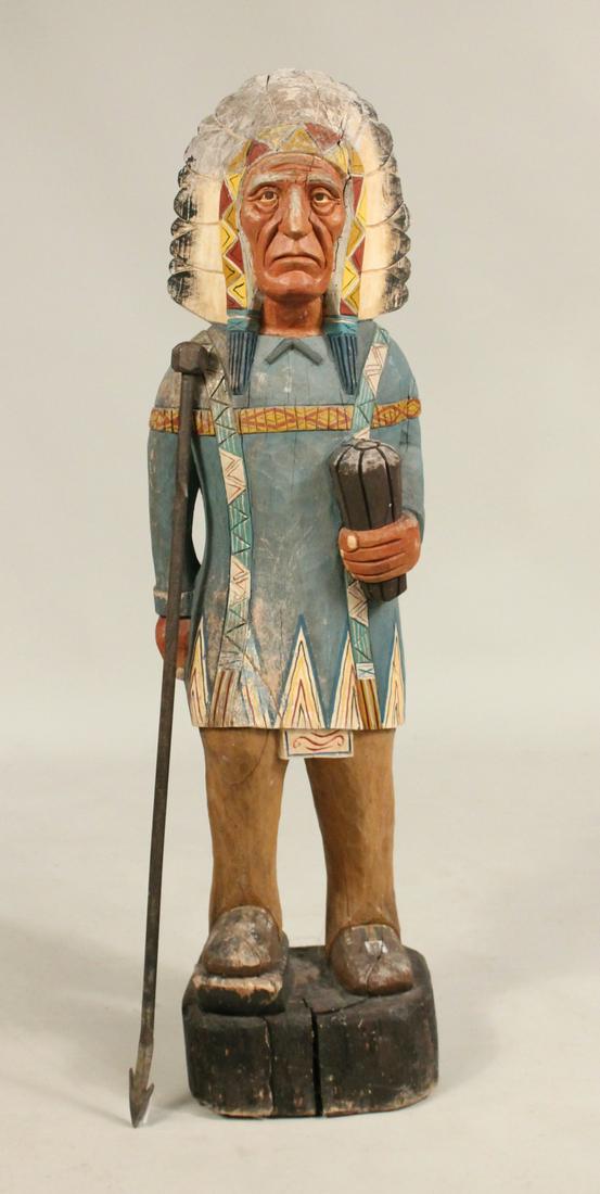 Carved and Painted Cigar Store Indian: Together with a steel arrow/spear. 4'1"h and 37"h Provenance: The Collection of the Estate of Elayne and Monroe Weinstein, Poughkeepsie, NY.