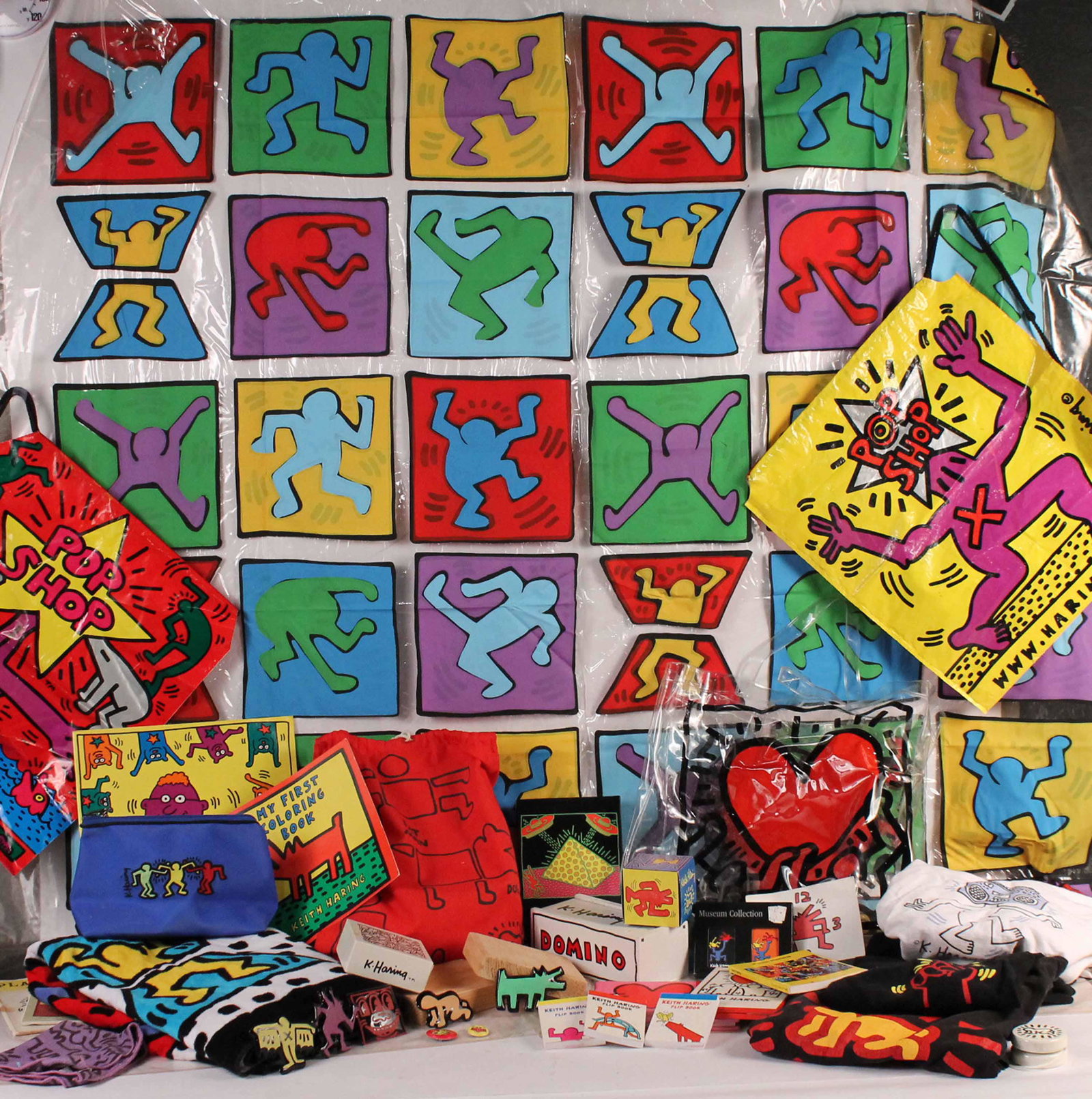 Group of Keith Haring Memorabilia: Including t-shirts, puzzles, towels, shower curtain, tote bag and coloring book. Provenance: The Collection of the Estate of Elayne and Monroe Weinstein, Poughkeepsie, NY.