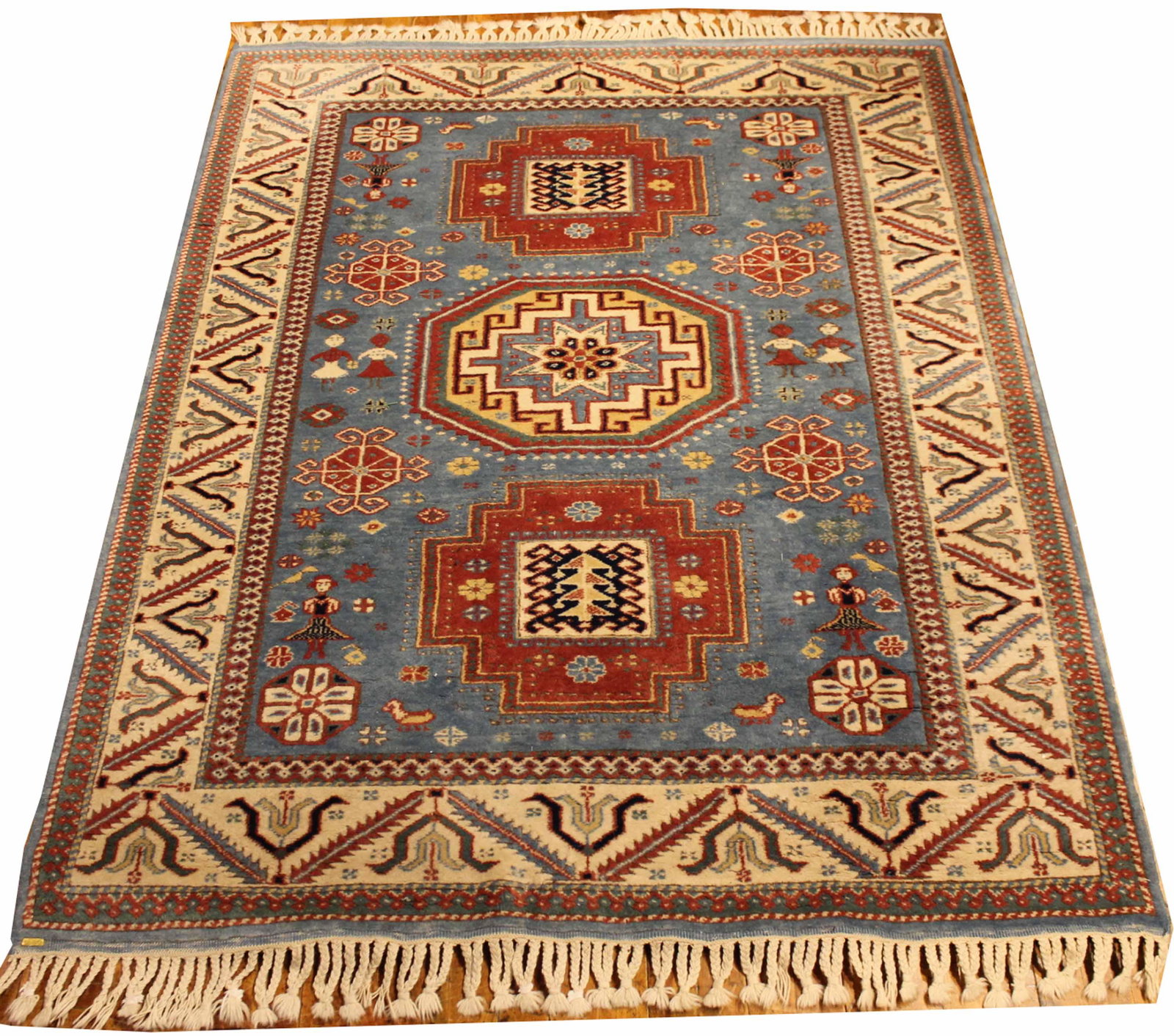 Heriz Style Rug: Worked in tones of light blue, rust, and ivory. 5'4"l x 4'2"w