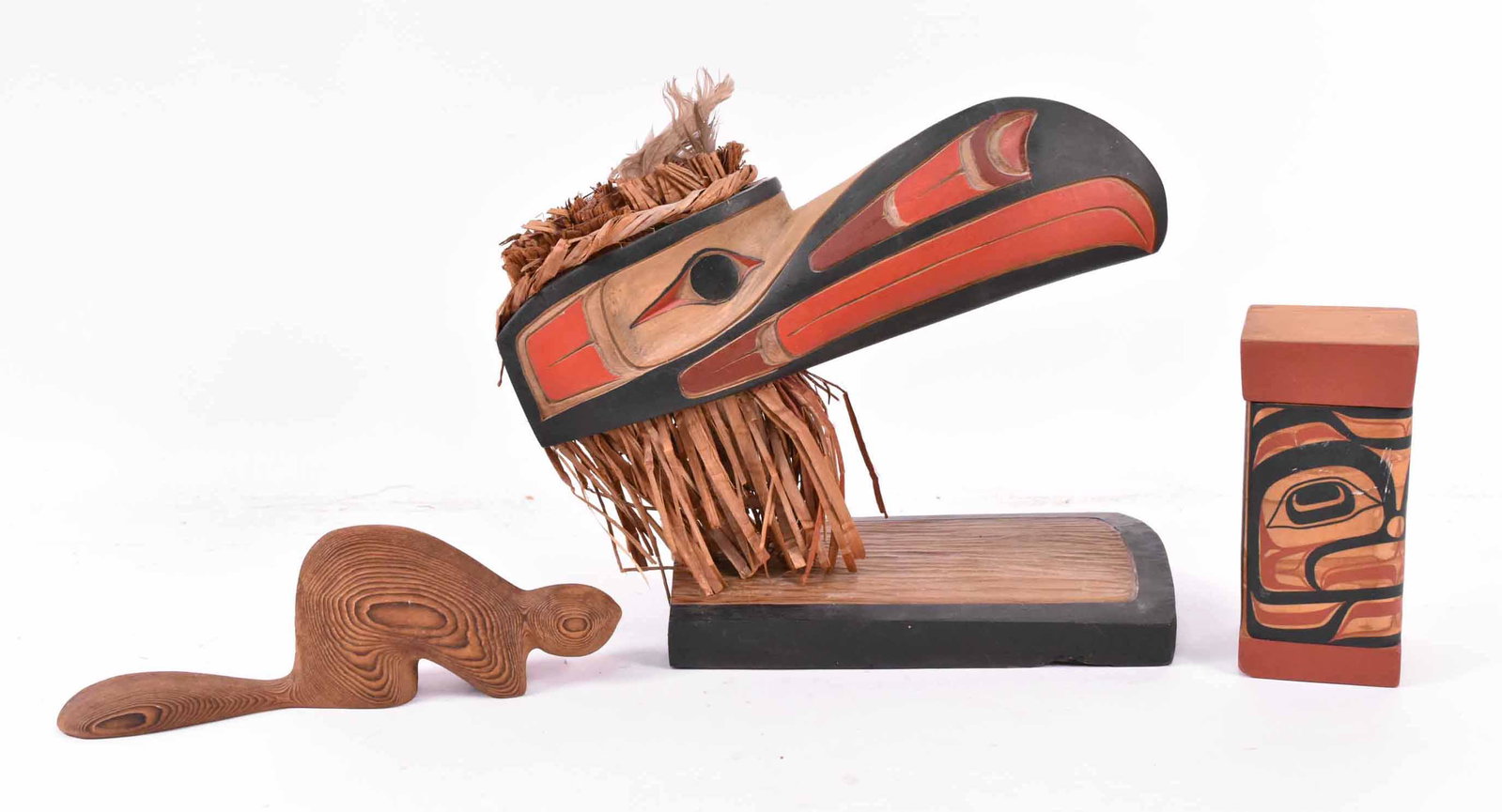 Carved Wood "Hamatsa Raven" Sampson Robertson: Northwest coast. Signed under base. Together with a John Livingston Bentwood box, signed under the box and a Canadian carved wood beaver. Size Raven: 13"l Provenance: The Collection of the Estate of E