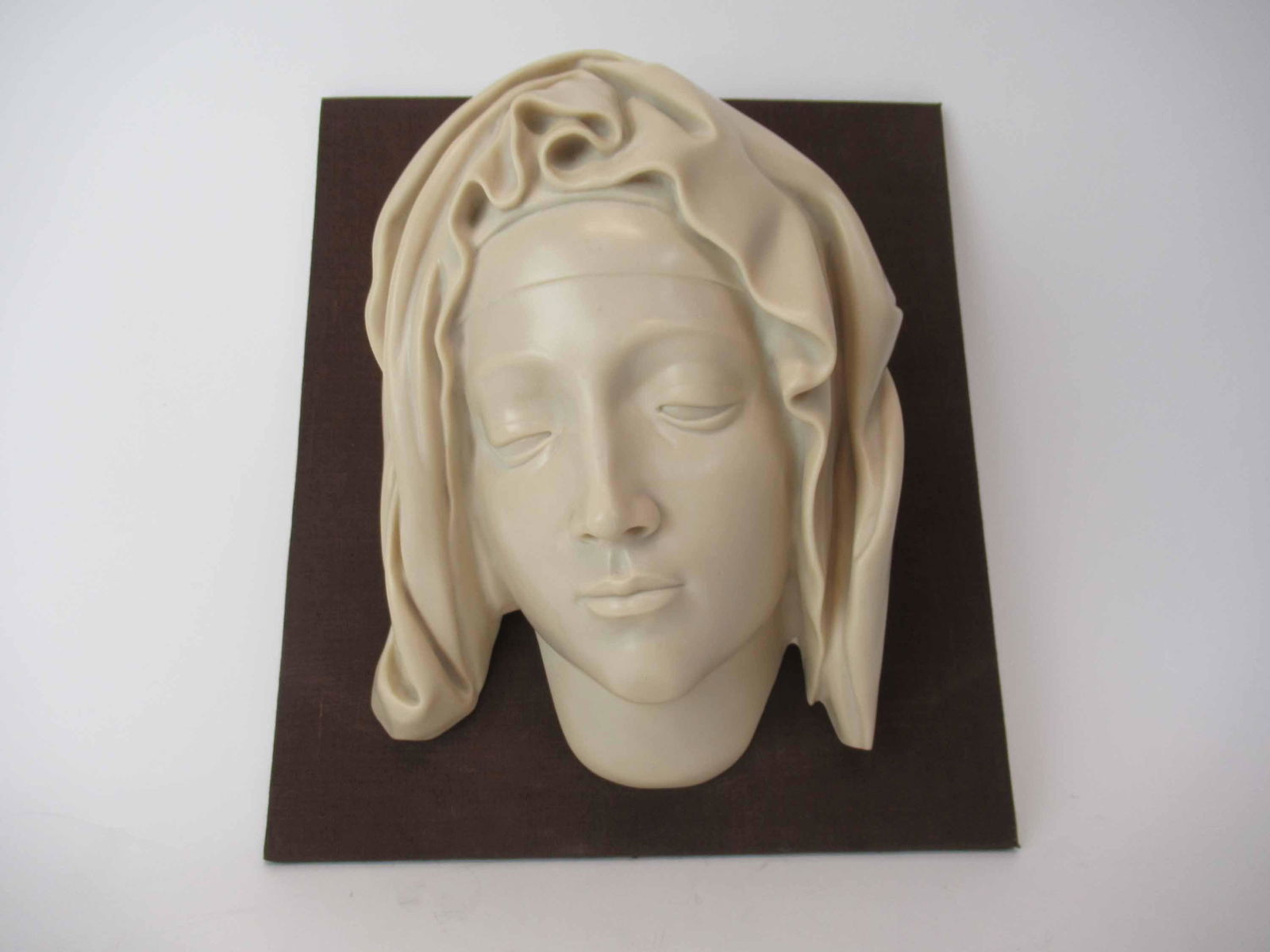 Head of The Virgin 1982 MMA: Head of The Virgin 1982 The Metropolitan Museum of Art Vatican collection composition wall plaque resting on board back. Used condition. head size 13 1/4" tall x 9" wide x 6" deep