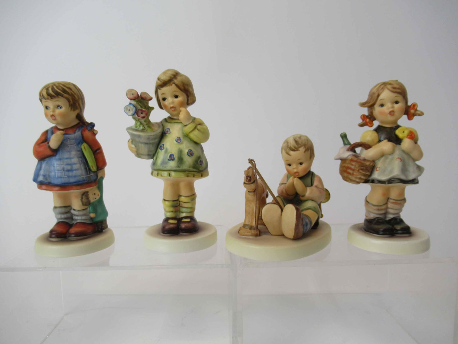 Four M. J. Hummel Goebel Figurines (1 of 9)
