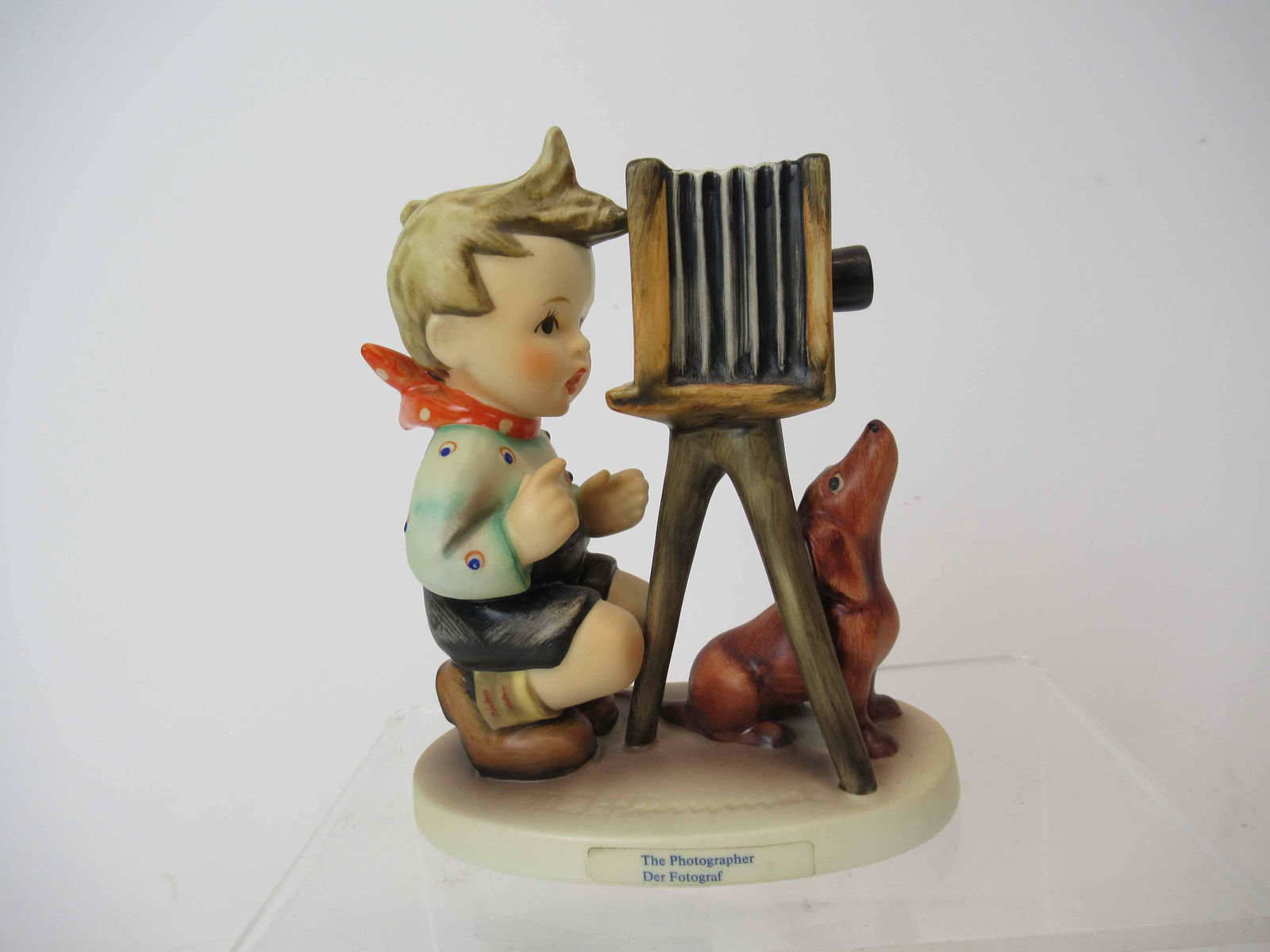 The Photographer M. J. Hummel Goebel Figurine: The Photographer M. J. Hummel Goebel Figurine together with box. Used condition. 4 1/2" tall x 4"