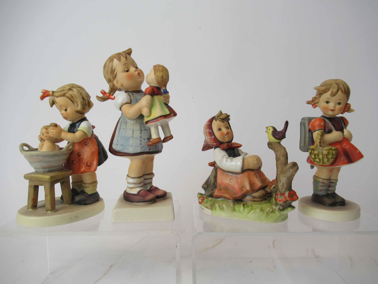 Four M. J. Hummel Goebel Figurines (1 of 6)