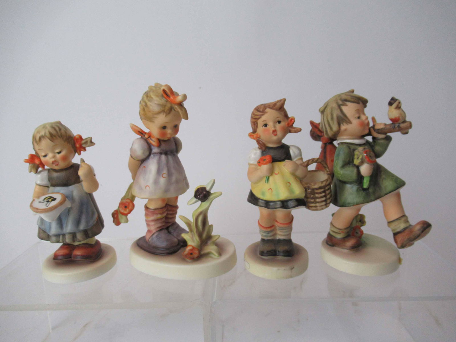 Four M. J. Hummel Goebel Figurines (1 of 7)