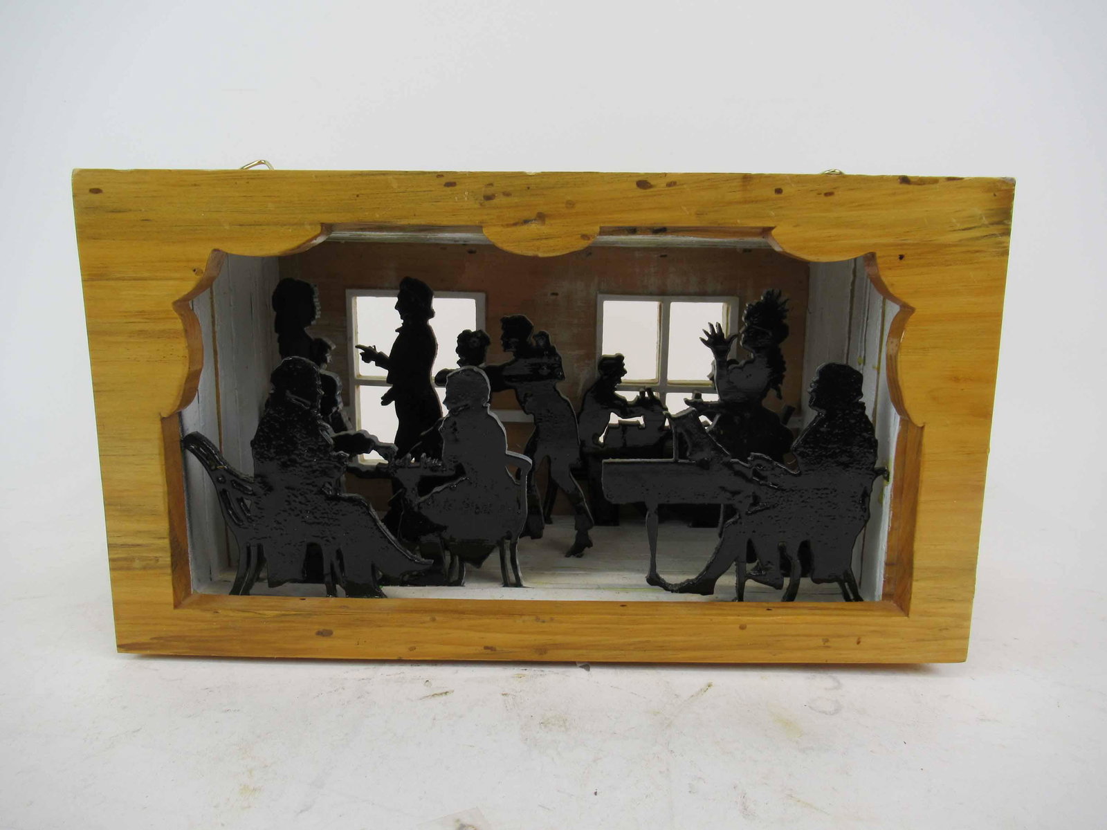 Carved Wooden Silhouette Diorama of a Social: Carved Wooden Silhouette Diorama of a Social depicting silhouettes of 19th Century figures dancing, playing games and playing music. marked on bottom, BAC 12-28-08 Pine, Titled " A Story Box". Used co