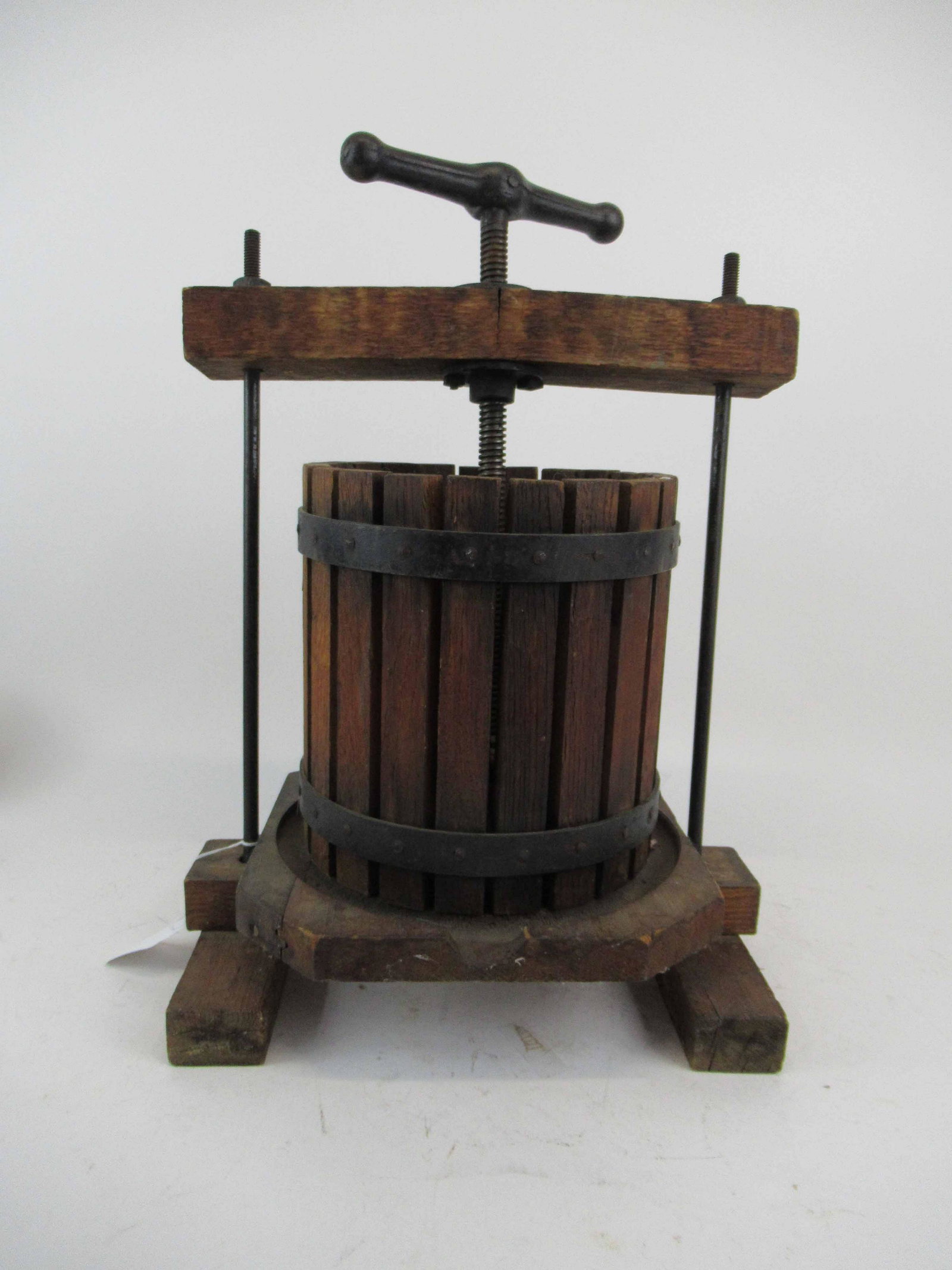 Vintage Oak Grape Wine Table Press: Vintage Oak Grape Wine Table Press having iron bands with slat barrel, stands 22" T x 15 1/2" W x 11" D, used condition, wear/worn, split to top and base