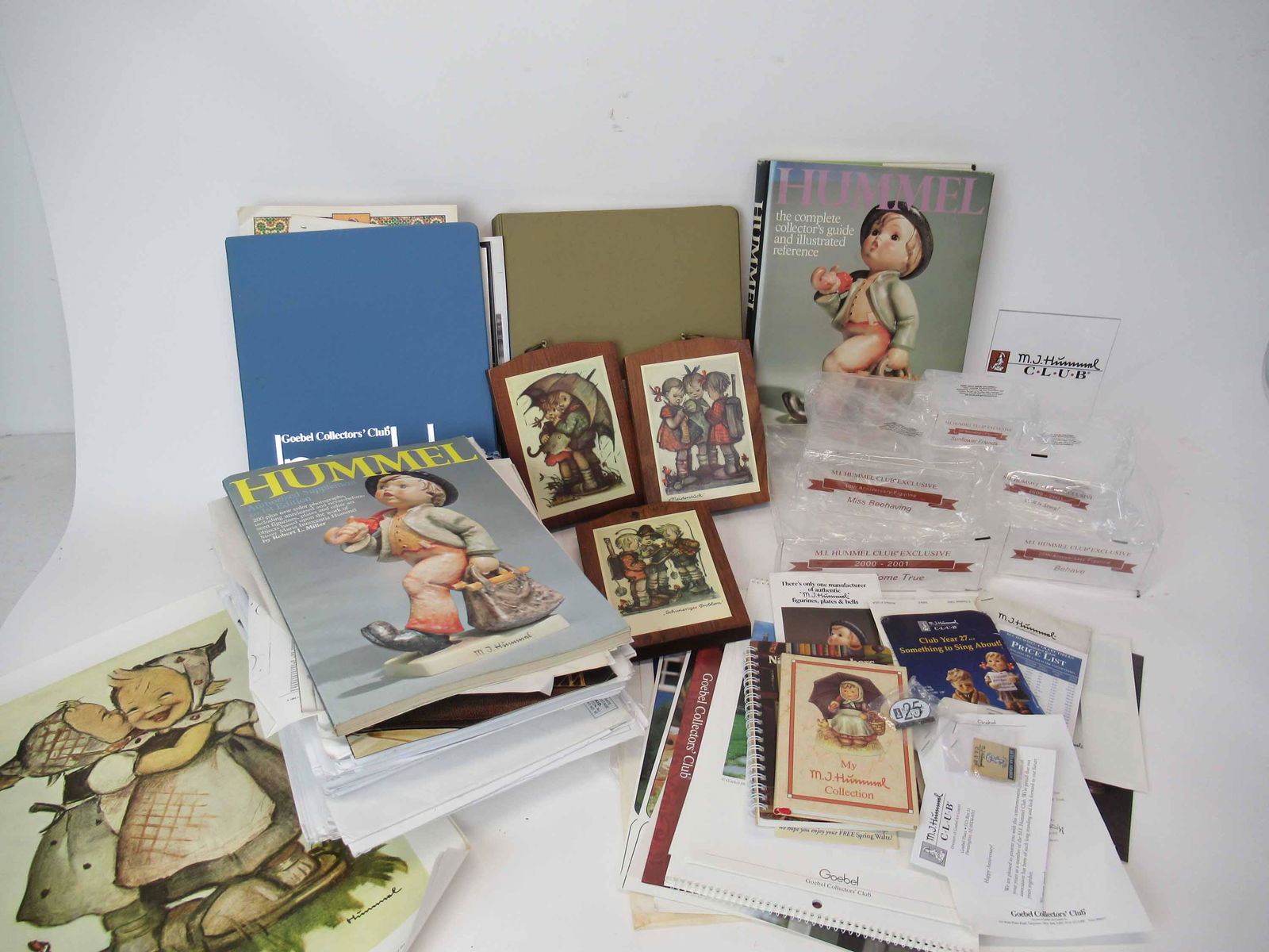 M. J. Hummel Goebel Ephemera: Group of M. J. Hummel Goebel Ephemera. Including calendars, price lists and stands. Used condition.
