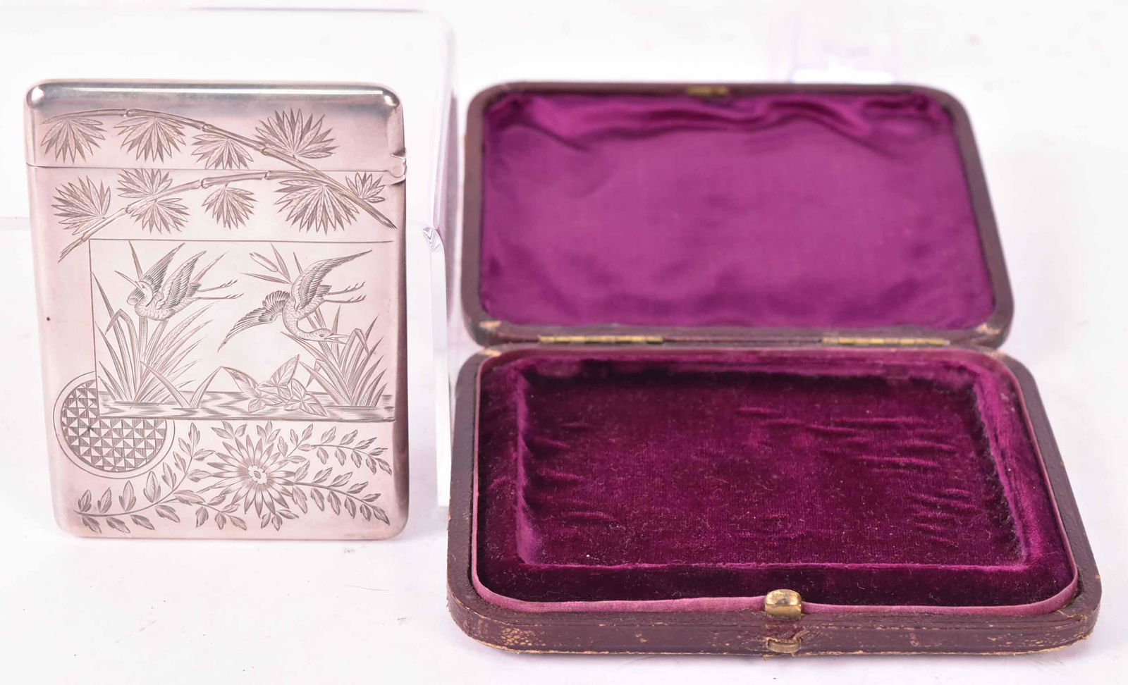 Victorian Silver Japanese Style Card Case: Makers Mark George Unite, Birmingham, 1879, monogrammed RTG, 3-3/4"l x 2-3/4"w, weight approx. 2 T.O., in original gold tooled leather hinged purple velvet and silk fitted case. Provenance: Property f