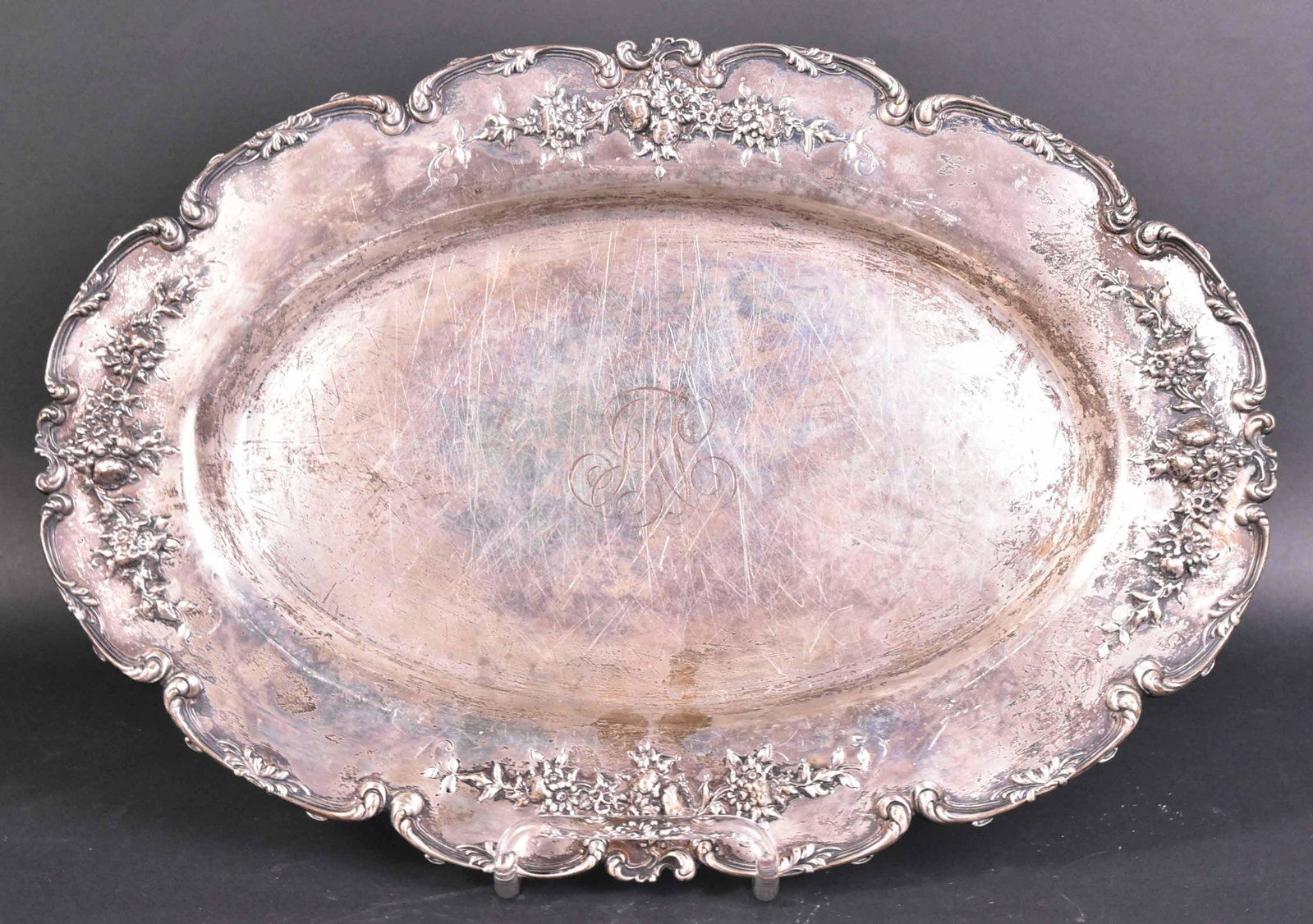 J.B. Hudson Sterling Silver Oval Tray: Scalloped border, centered monogram, #4279E, floral decorated, 16"l, weight approx. 30 T.O.
