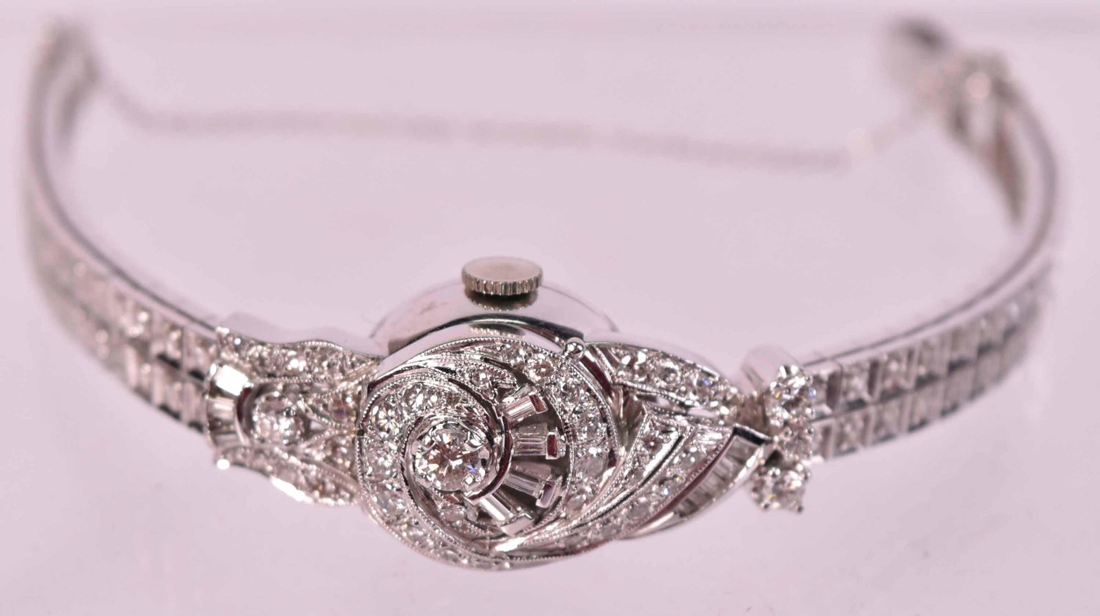 Hamilton 14K White Gold Diamond Bracelet Watch: Containing five round prong set diamonds, total weight approx. .60carats, twelve small bagette cut diamonds, approx. 101 bead set diamonds, total carat weight approx. 2.60carats, gross weight approx. 