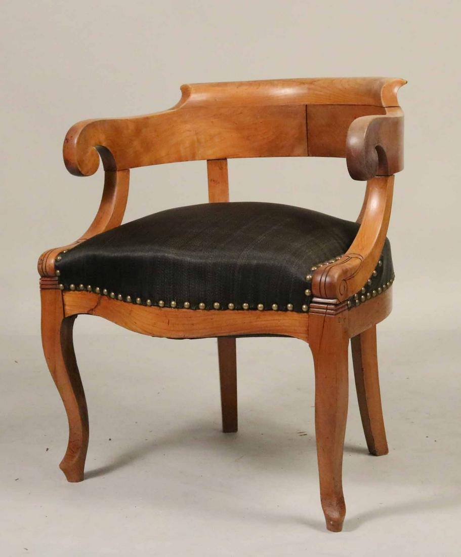 Biedermeier Cherrywood Curved Back Armchair: Continental, mid-19th C. Back rail loose. 28-3/4"h x 23-1/4"w x 23"d Provenance: Property from a Private Collection Illustrated in the New York Times' Real Estate Section, June 26, 2016, Park Avenue, 