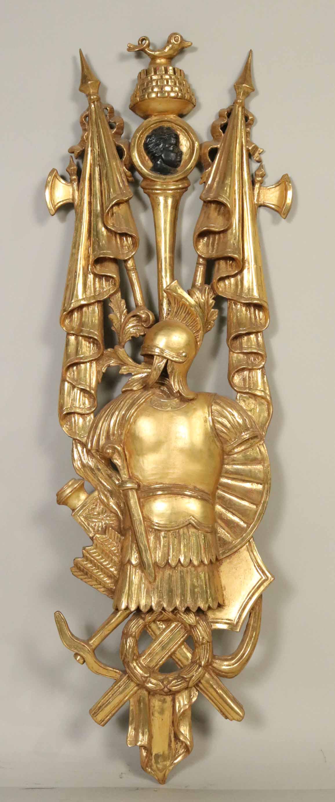Carved Giltwood Plaque of French Military Emblem: 19th/20th C. with military armor surrounded by battle flags and swords. Gilt refreshed. Apx. 4'2"h x 14-1/2"w