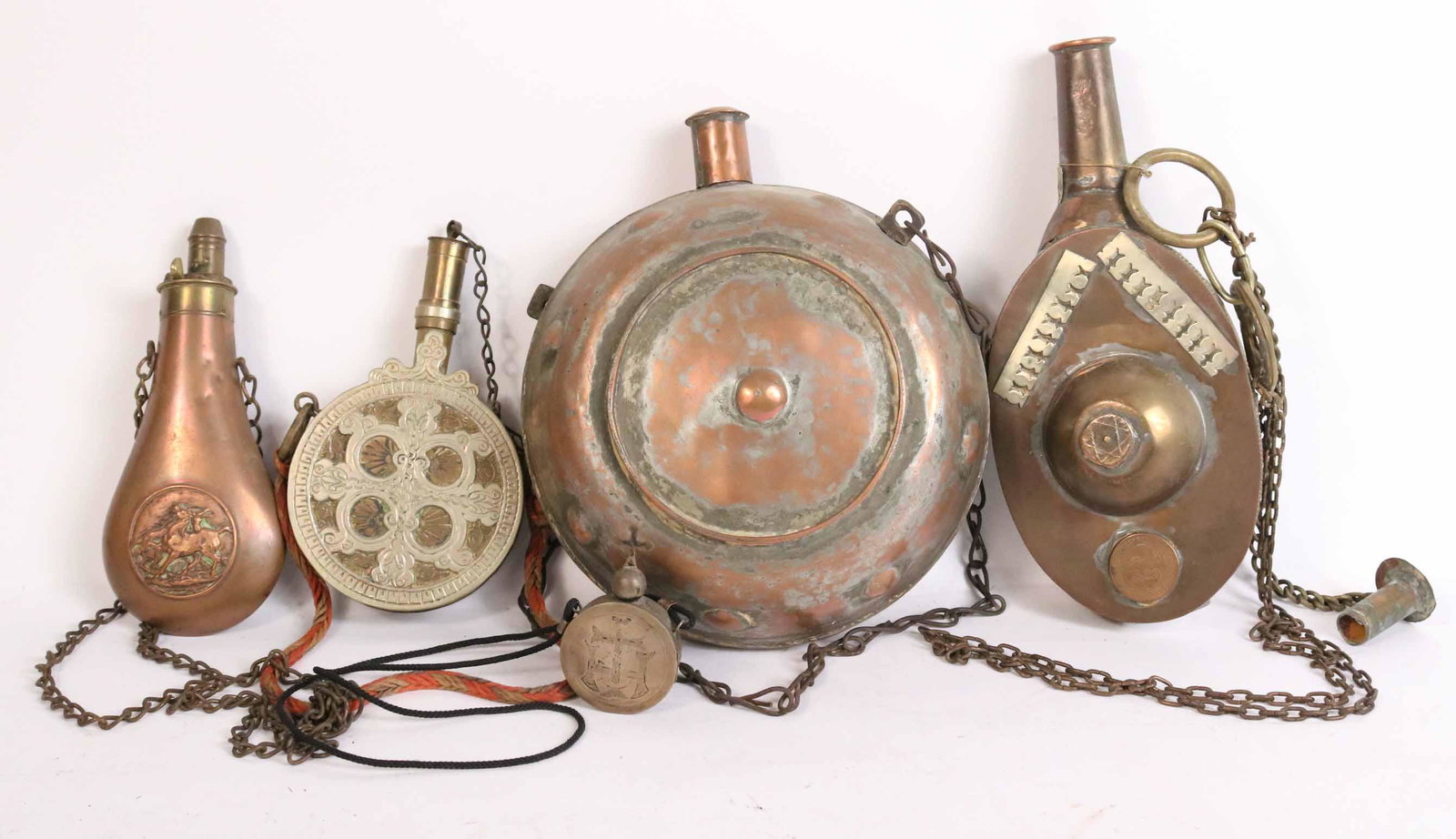 Five Brass and Copper Canteens and Flasks: 19th C., some monogrammed and engraved. Dents and wear. From: 9-1/2"h x 8"w to 3"h x 2"w