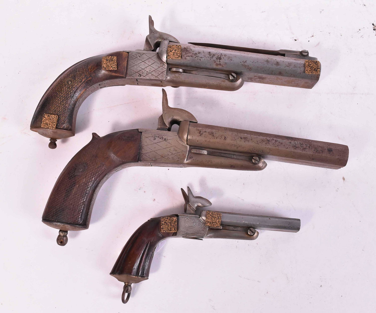 Three Double-Barrel Percussion Pistols: French/Spanish, 19th C., one with retractable bayonet. 10"l, 10-1/2"l an 6"l