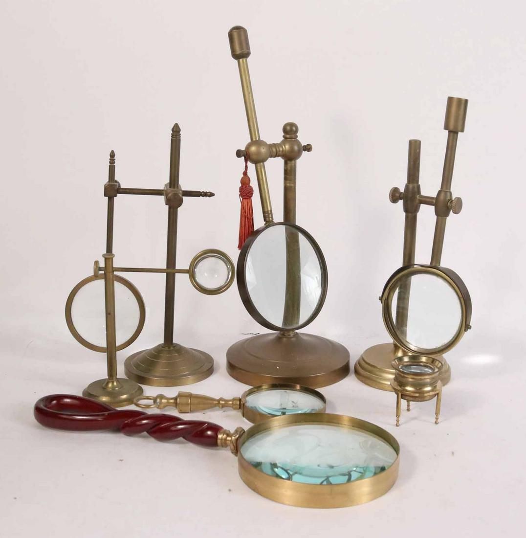 Seven Magnifying Glasses: Four on adjustable stands. Largest: 9-1/2"h