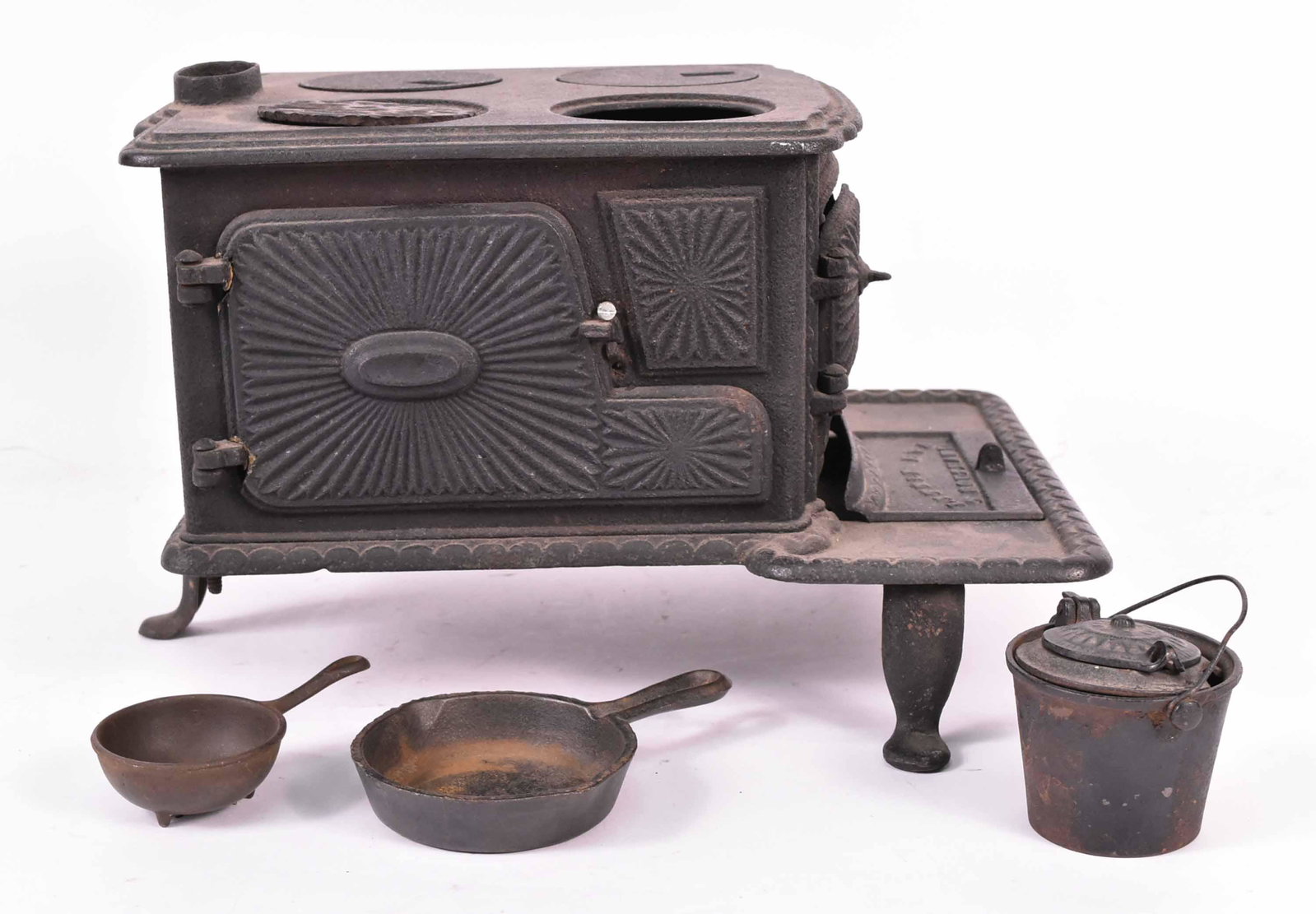 Miniature Cast-Iron Stove, Little Eva, T Southard: 19th/20th C. 8-1/2"h x 13-1/2"w x 10-1/2"d Provenance: Property from the Collection of Eric Martin Wunsch, New York City
