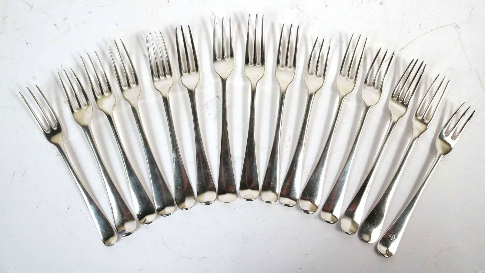 Fifteen Georgian Hanoverian Pattern Three Tine: Forks, various makers, including HB, likely Hester Bateman, GS, George Smith, TF, IC, WW, each 7-7-1/2"l, total weight approx. 28 T.O. Property from the Estate of Ralph & Roberta Carpenter.