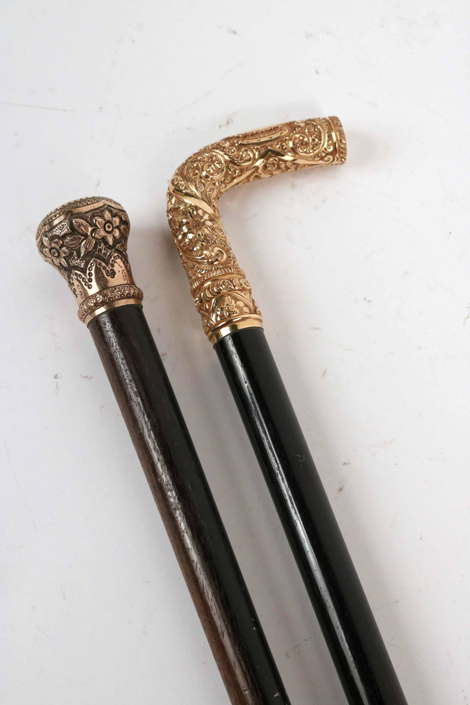 Two Rolled Gold Canes: Both are inscribed. The second cane is a handled cane. 36"l.One engraved "New Haven Aero(?) to B. J. Monaghan."B.J. Monaghan was a Philadelphia businessman. The 1909 Chicago Daily News Almanac and Yea