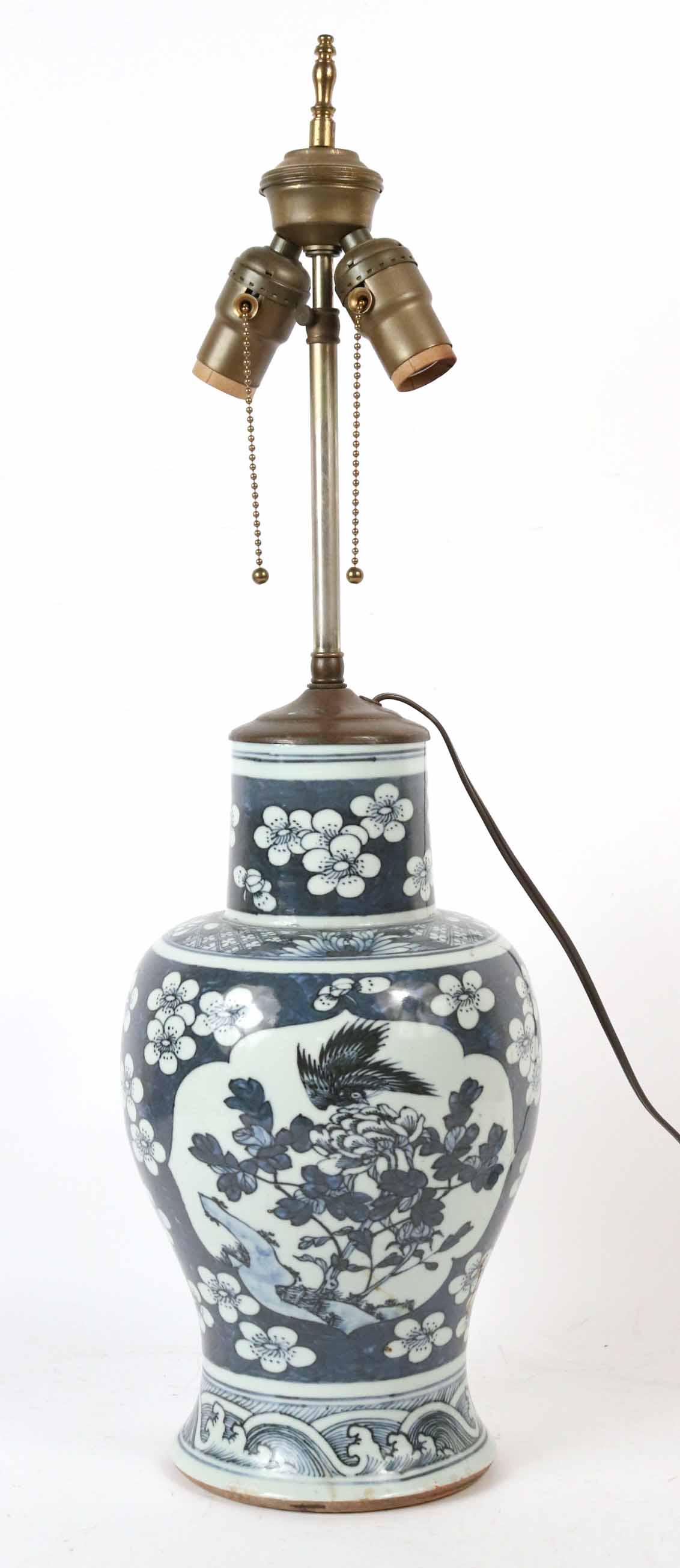 Chinese Blue and White Porcelain Vase: Of baluster-form, decorated with prunus on a cracked ice ground, fitted as a lamp. Vase: 13-1/2"h Property from the Estate of Ralph & Roberta Carpenter.