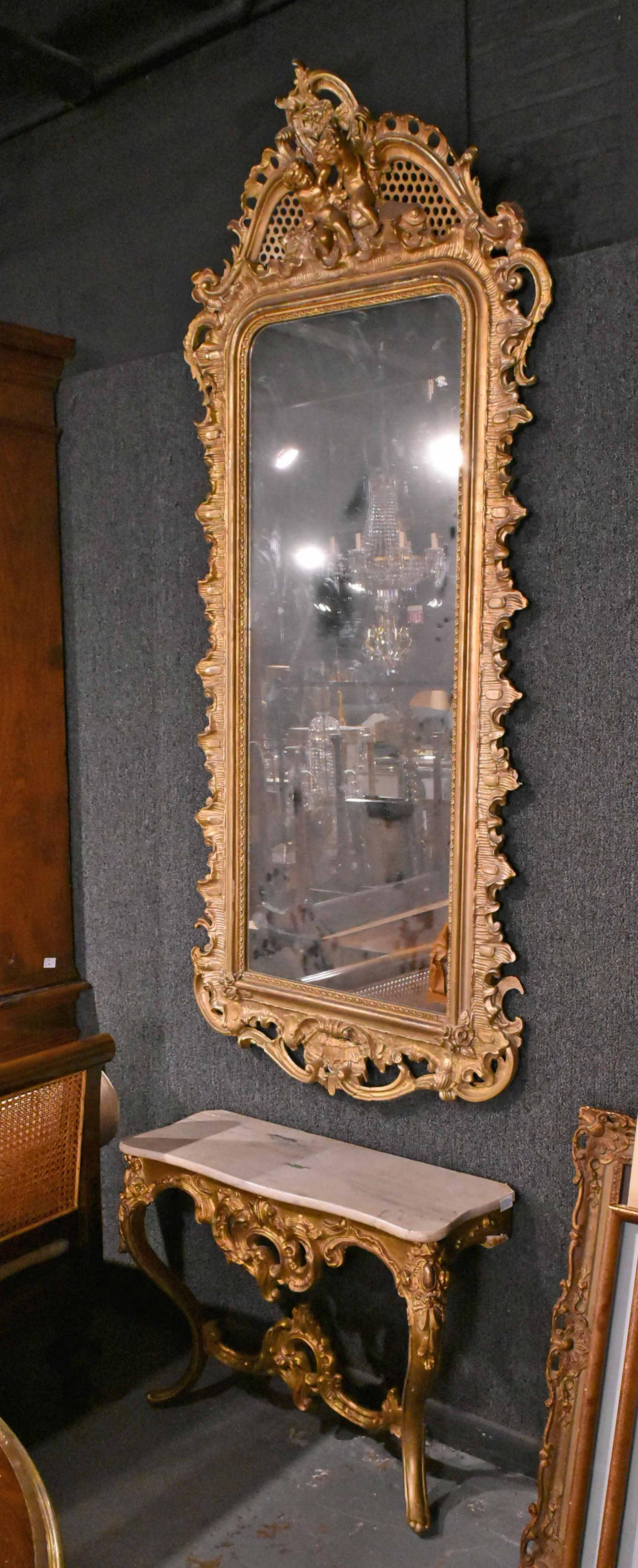 Louis XV-Style Giltwood Pier Mirror and Console: Late 19th C., Mirror of impressive size, console with faux-marble top. Losses to gesso elements on table and mirror. Mirror: 7'1"h x 37"w x 7"d Table: 25"h x 35"w x 13"d