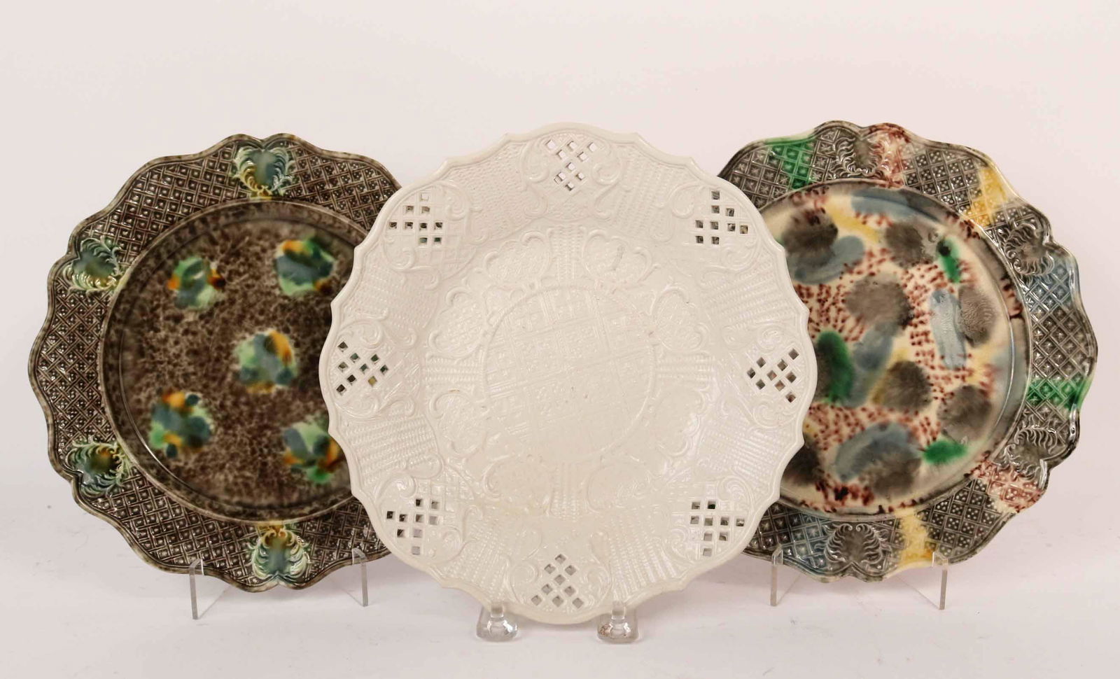 Two Whieldon Creamware Plates: English, 18th Century. Together with an English stone glazed plate with reticulated rim. Size: 9"d Property from a Private Westchester New York Collection. Provenance: Whieldon ware plates have labels