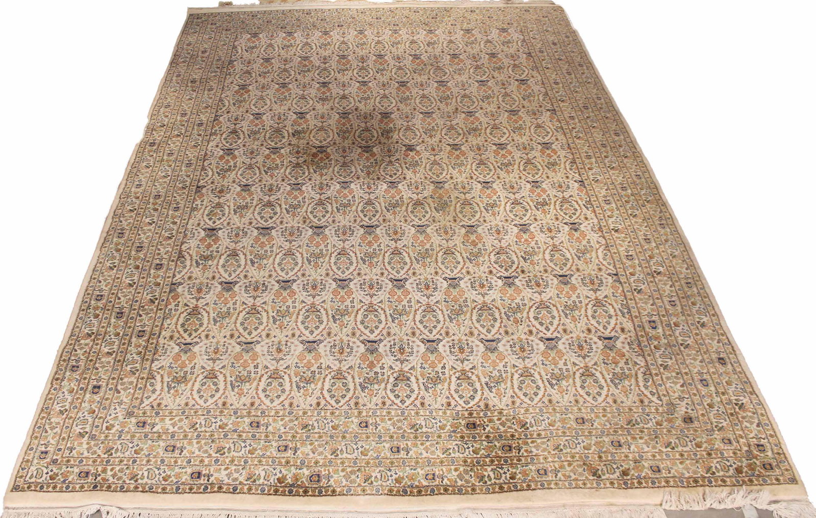 Oriental Rug: Made in India, worked in tones of beige, ivory, blue, green, and rust, with repeating floral motif. 14'5"l x 10'w
