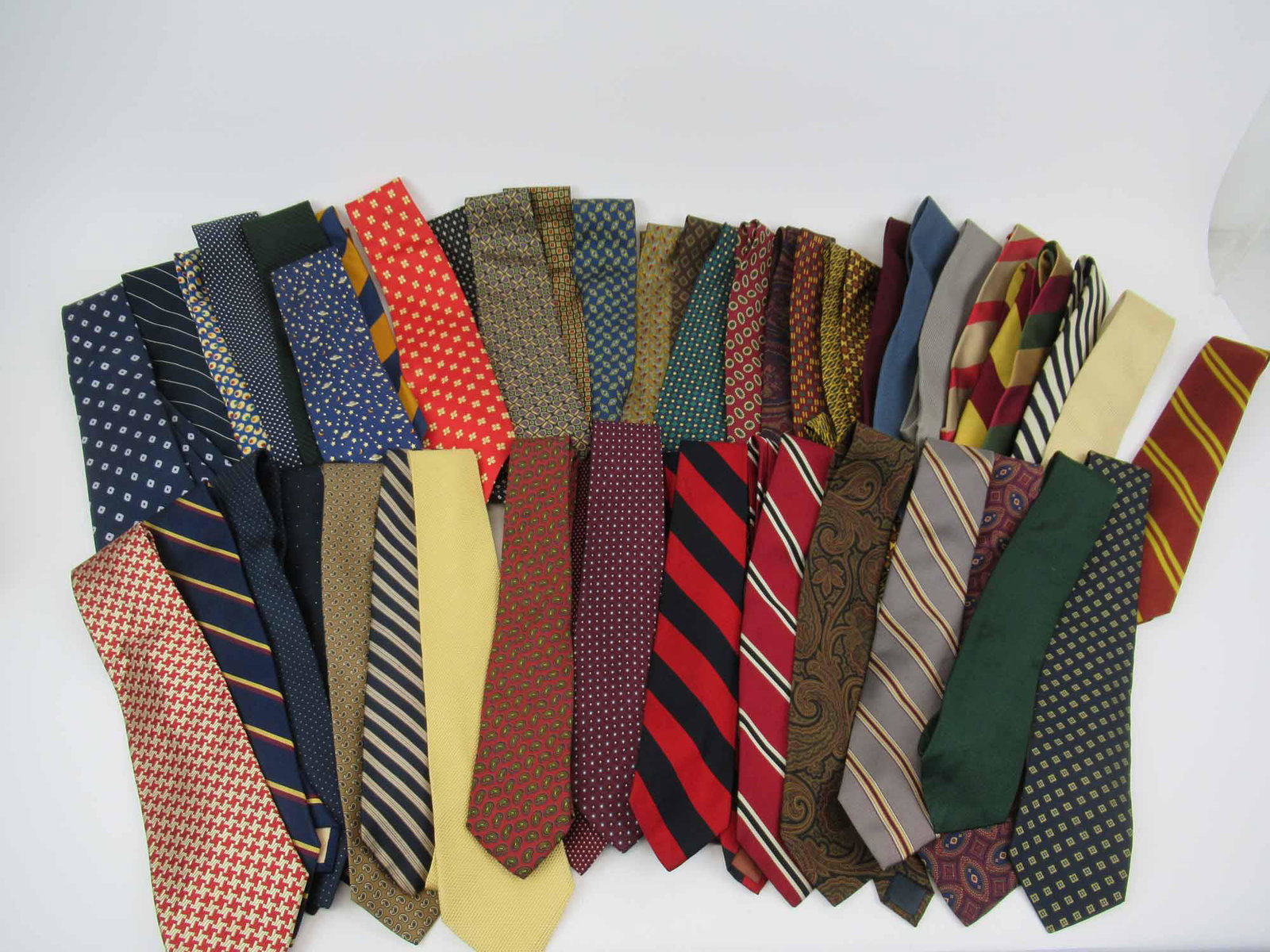 21 Vintage Paul Stuart Ties: 21 Vintage Paul Stuart Ties. Together with 25 Barneys New York ties. Used condition, some wear, some stains.