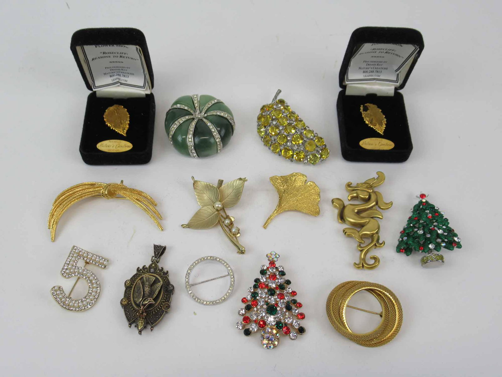 Group of Assorted Costume Brooches: Group of Assorted Costume Brooches including Kenneth Lane, Newport Flower Show and MMA. Used condition