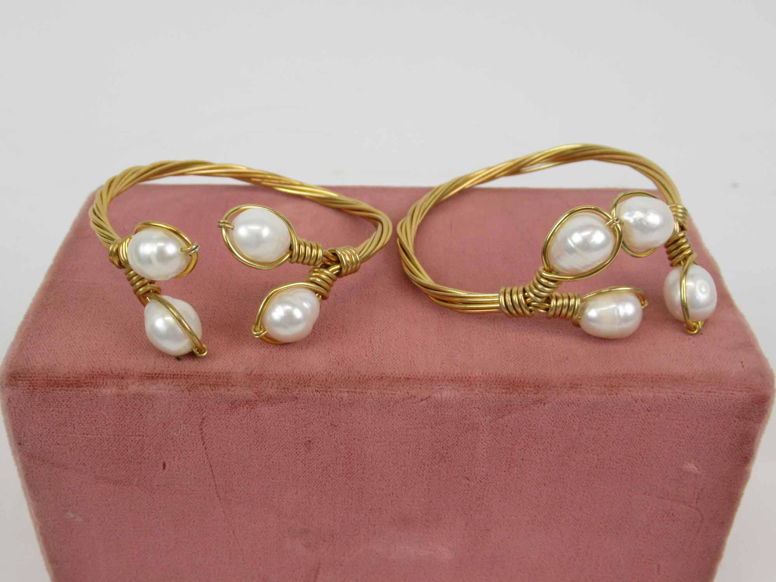 Pair of Gold Tone Wire & Pearl Bangle Bracelets: Each with four baroque pearls, interior approx. 2-1/4".