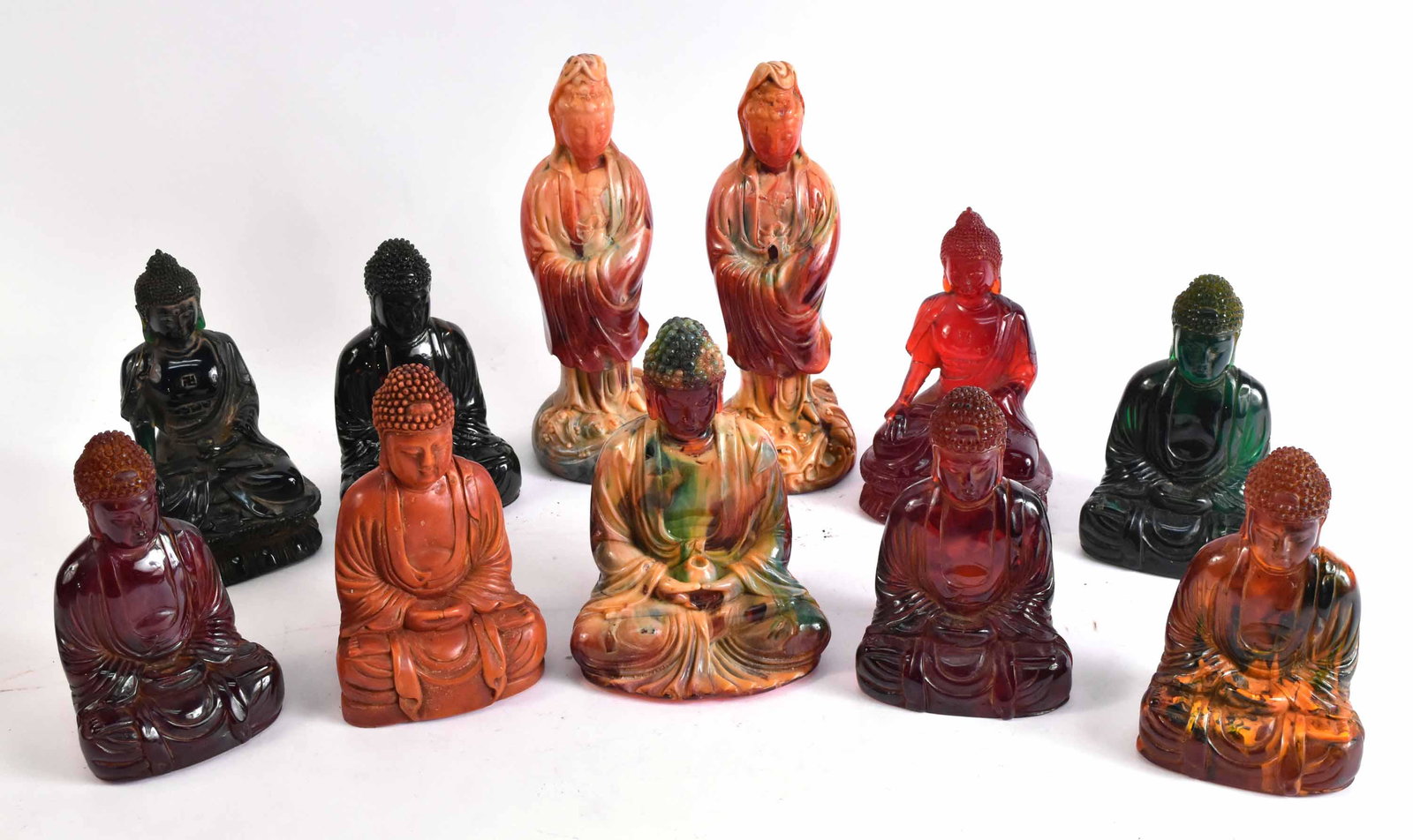 Eleven Resin Buddhas and Deities: Various colors and styles. Tallest: 10"h