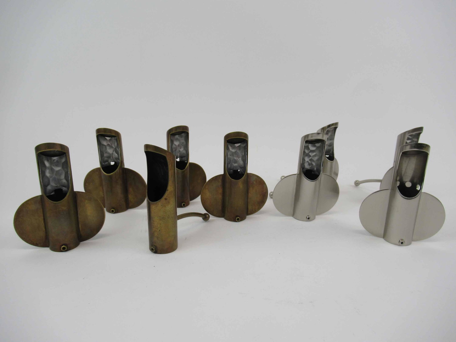 9 Vintage Airplane Style Lighting Shades: 9 Vintage Airplane Style Lighting Shades. 5 in a bronze finish and 4 in a satin nickel finish. Used condition, 4 1/2" long x 4" tall.