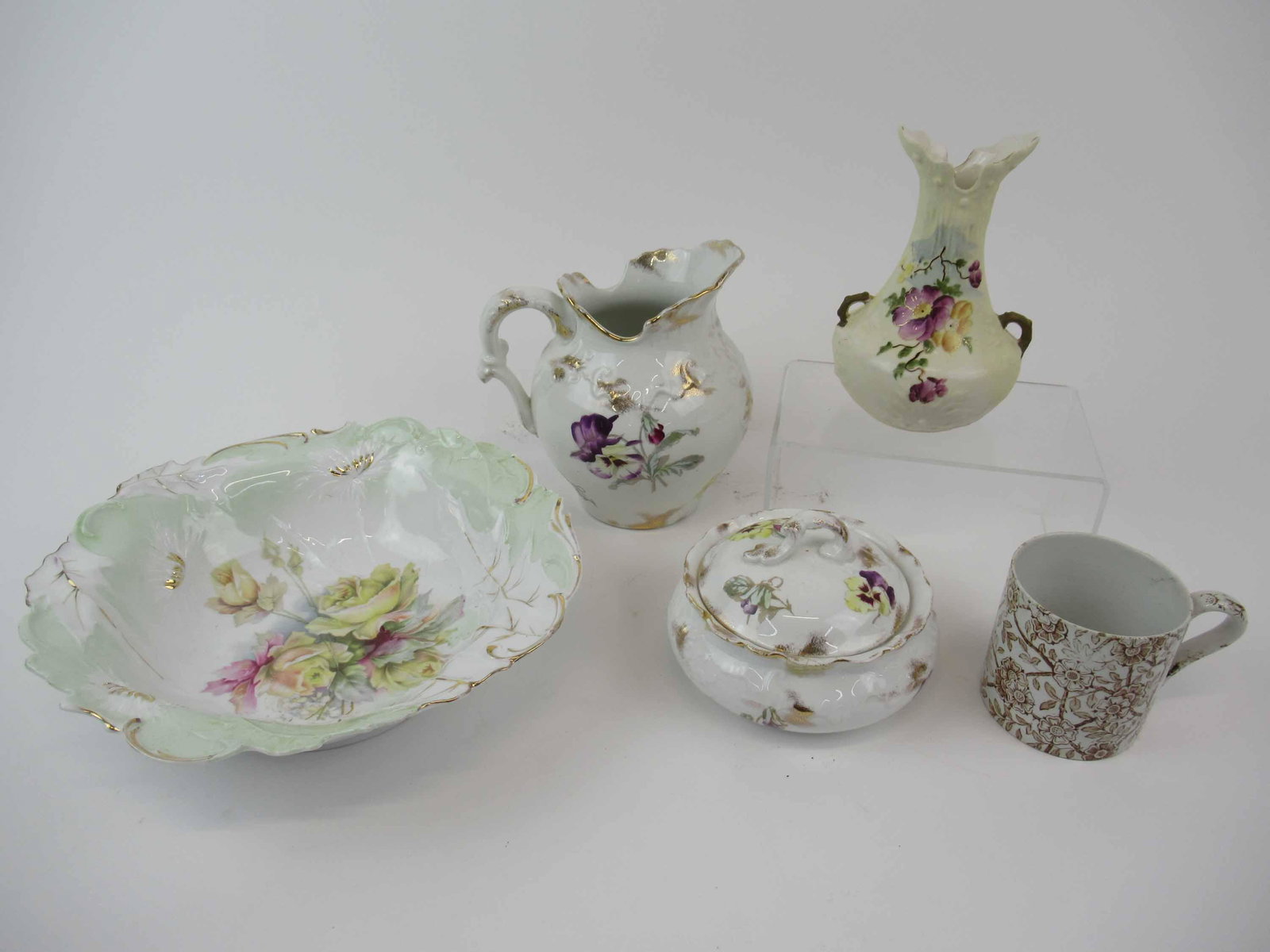 Group of Assorted Porcelain Table Articles: Group of Assorted Porcelain Table Articles including floral bowl, vase, mug, covered sugar and pitcher. Used condition, chips, crazing and repair to sugar bowl. Bowl size 10 1/4" dia