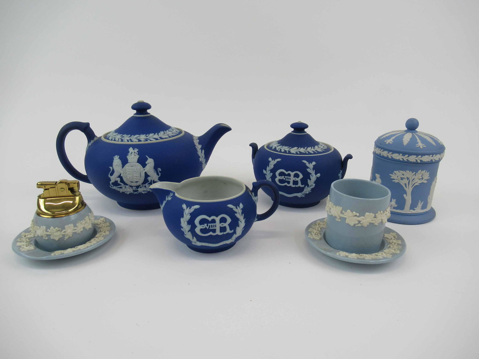 Wedgwood Jasperware Edward the XVIII Tea Service: Wedgwood Jasperware Dark Blue Edward the XVIII Commemorative Tea Service. Comprising of tea pot, lidded sugar and creamer. Together with Jasperware lidded jar, Queensware two ashtrays, lighter and cup