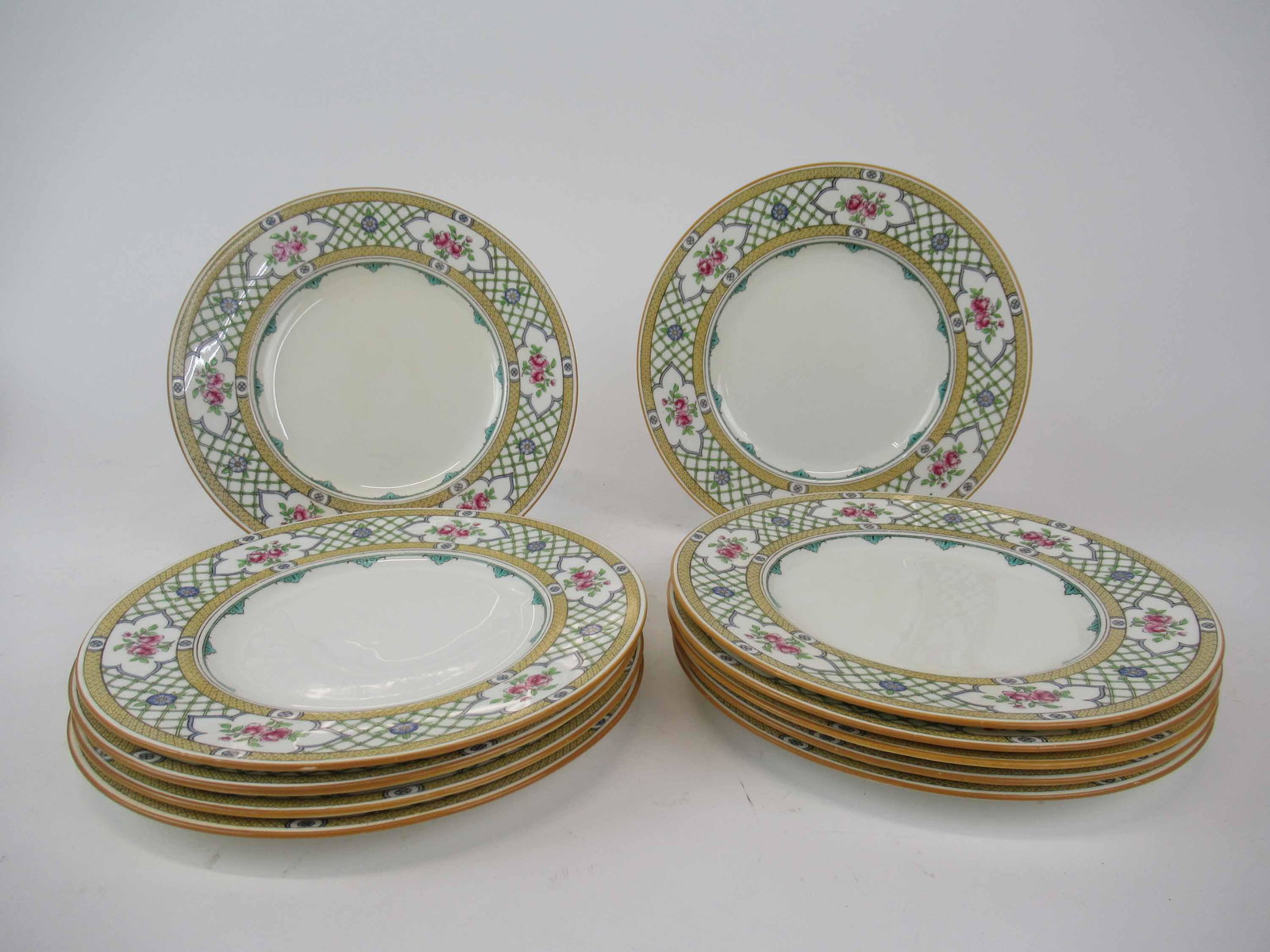 Minton for Tiffany Queens Trellis Luncheon Plates: Set of 11 Minton for Tiffany Queens Trellis Luncheon Plates. Used condition, one cracked, one hairline, wear, worn, stains, knives marks, discoloration, crazing. 9" diameter