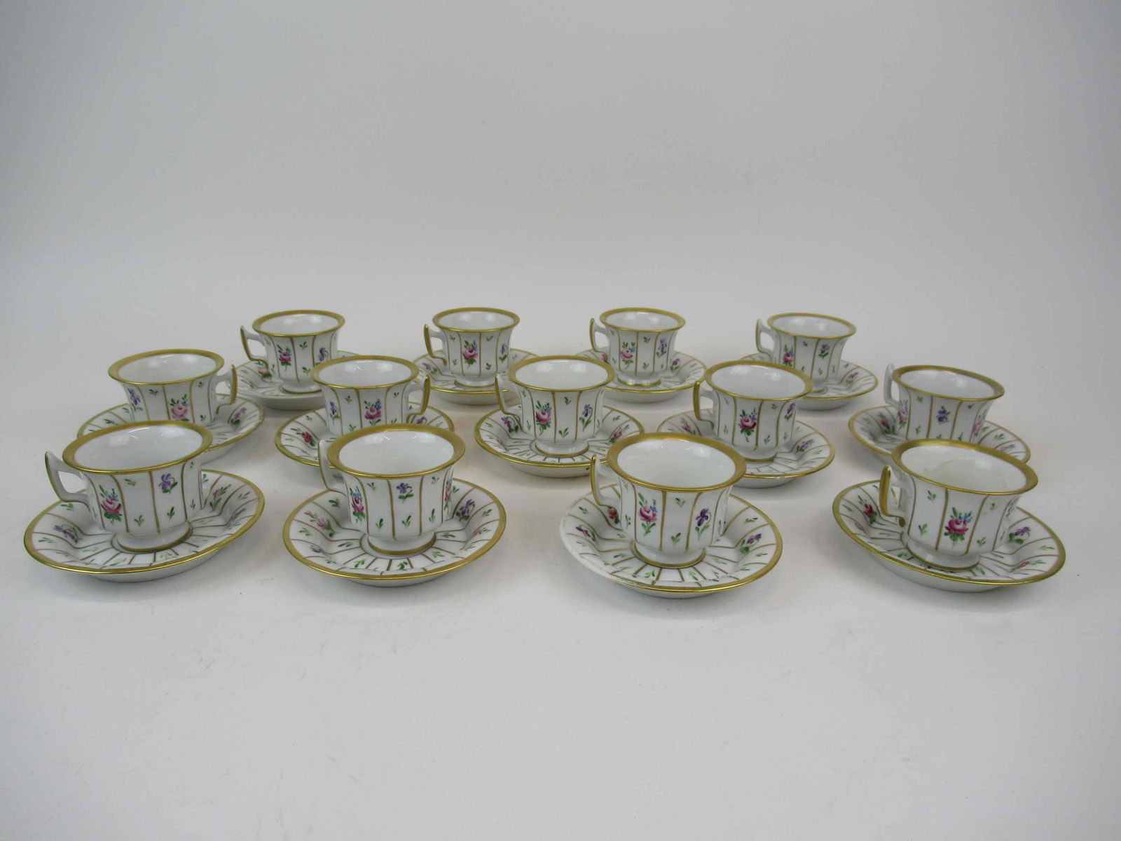 13 Krautheim Demitasse Cup and Saucer Sets: 13 Krautheim Germany Hand Painted Demitasse Cup and Saucer Sets. Used condition, gilt wear, 3 saucers have chips and one cups has chip.