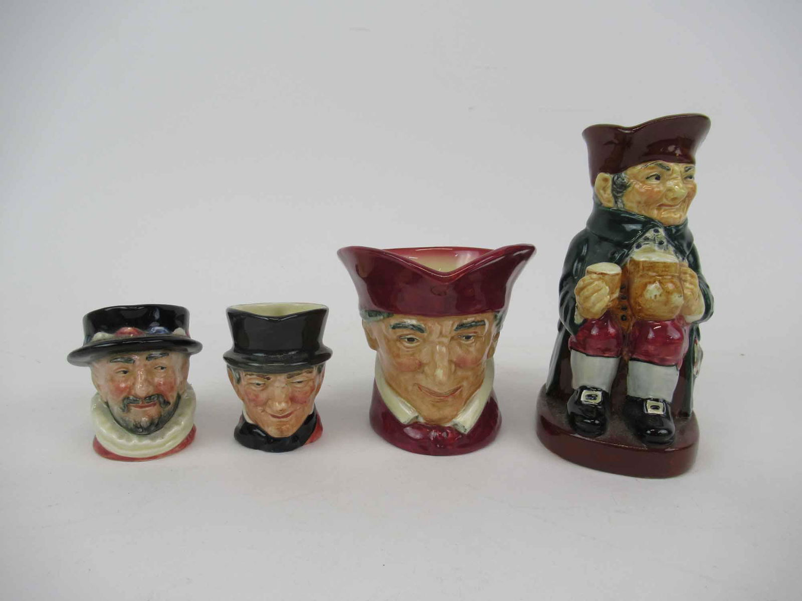 Group of Assorted Daulton Toby Creamers (1 of 7)