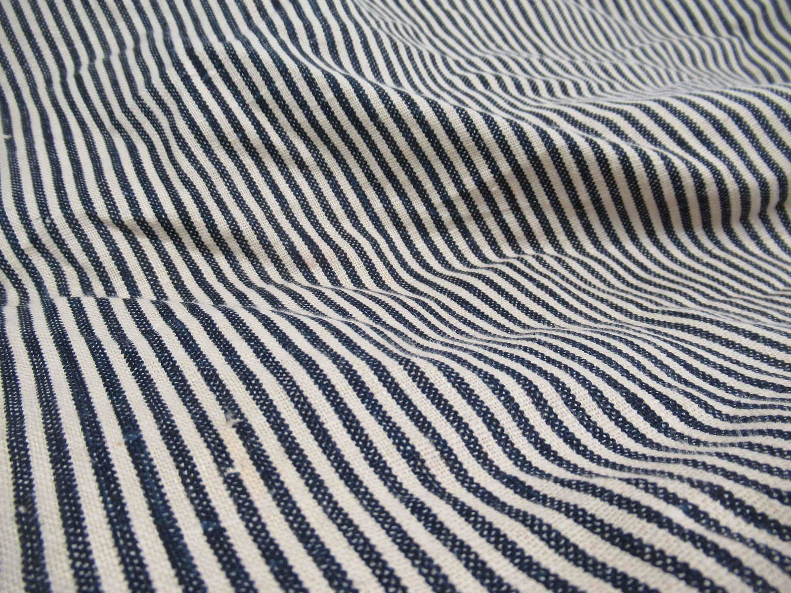 Slubby Linen Blend Ticking Fabric: Slubby Linen Blend Ticking Fabric navy and neutral in color, possibly Ralph Lauren. Used condition. Size change, size measures 35 feet long x 57" wide.
