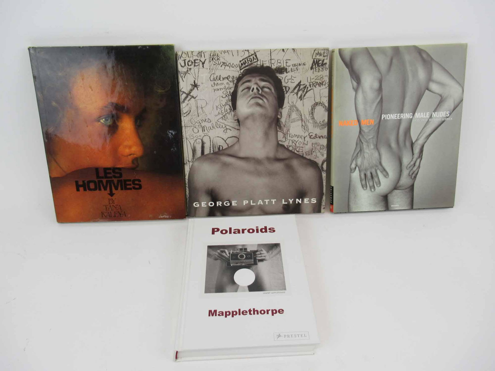 Four Photographic Books of the Male Form: Group of Photographic Books of the Male Form. Including Polaroids, Mapplethorpe; Naked Men, Pioneering Male Nudes, 1935-1955 David Leddick; George Platt Lynes; and Les Hommes, Tana Kaleya. Used condit