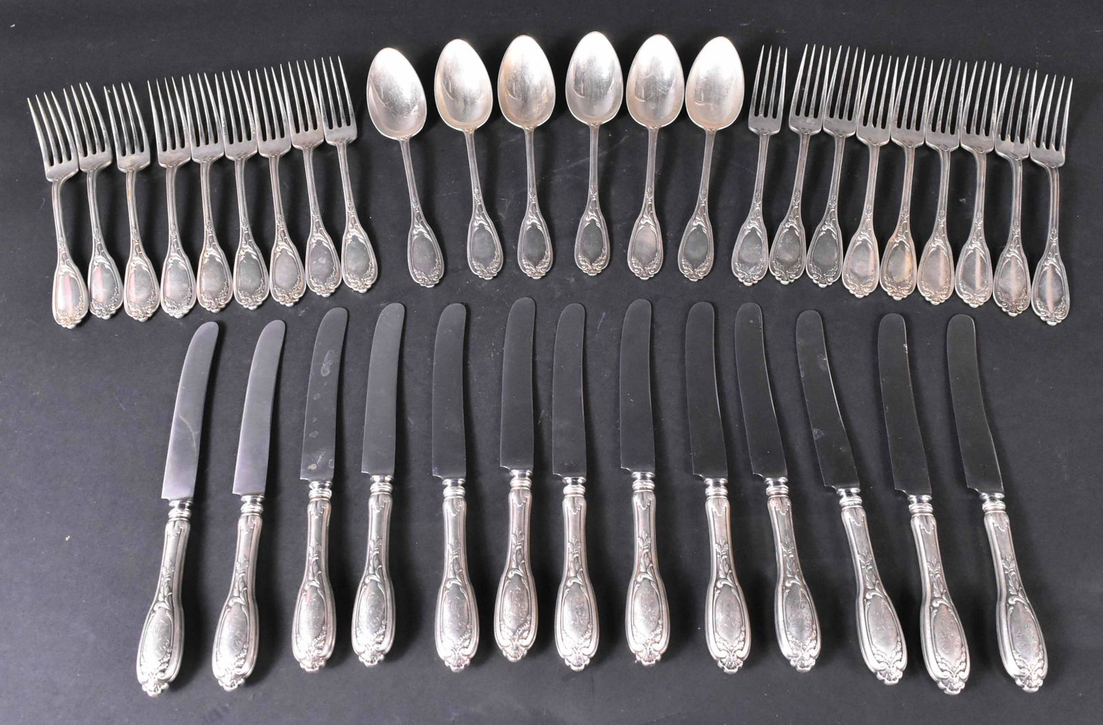 Russian Silver Partial Flatware Service: 19th Century, 84 stamp for 875/1000 standard, double eagle for Moscow, by Grachev Bros., HL cipher monogram on handle reserve,pattern of carved oak leaves, acorns and acanthus leaves on both sides, co