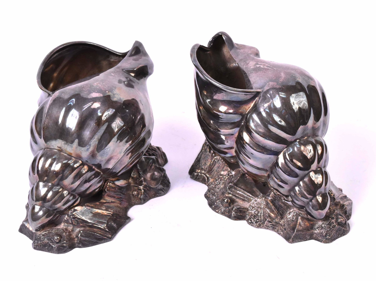 Pair of Victorian Silver Plated Spoon Warmers: Shell form on rock work bases, each stamped HA EA FA, English registry mark, each 4-1/2"h x 6-1/2"w. Provenance: Property from the Estate of Judith Applegate, Princeton, NJ.