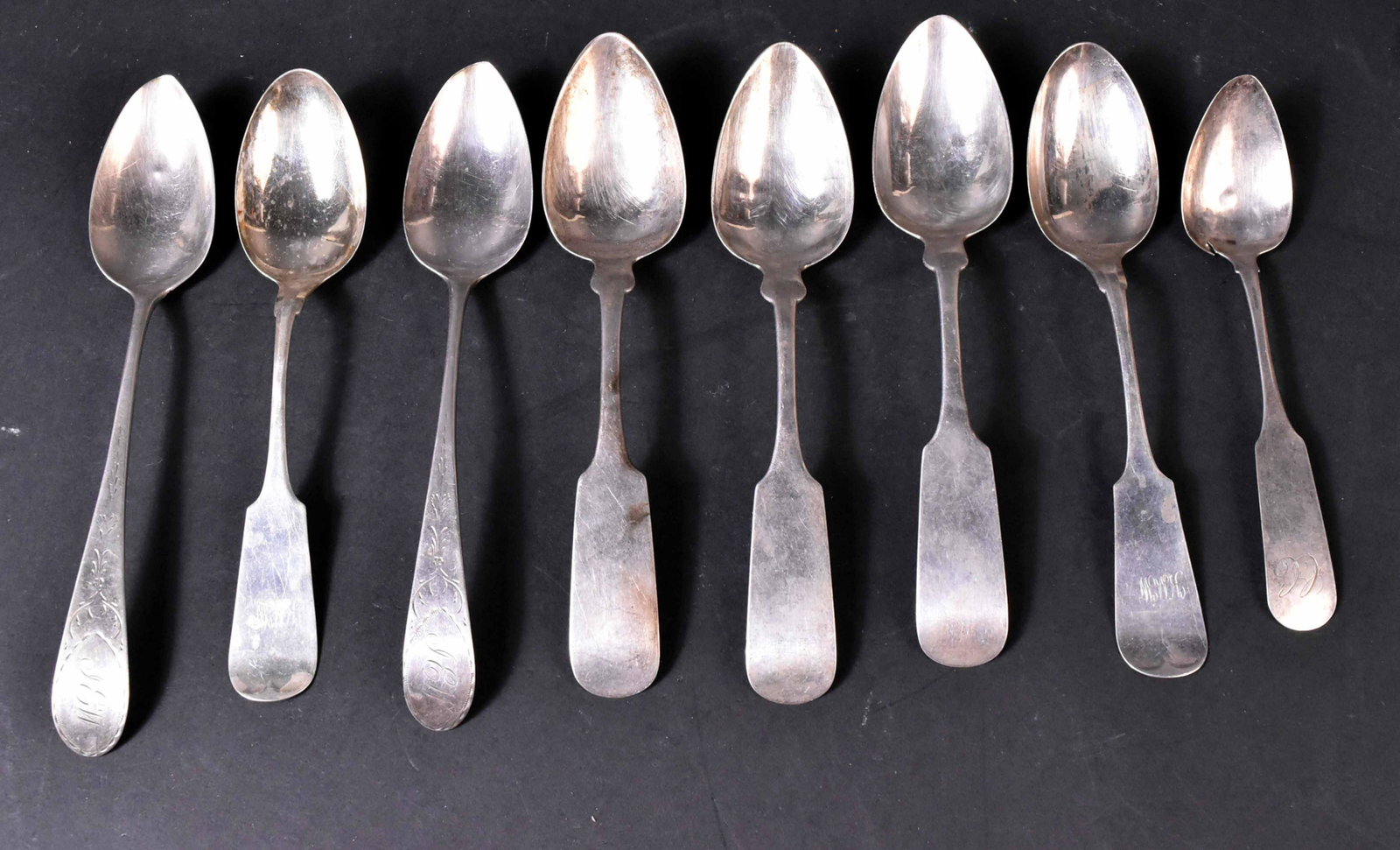 Eight American Silver Spoons: Fiddle pattern, three with maker's mark W.H. White Sterling, Philadelphia, each 8-1/2"l, pair stamped with Whiting signature and Sterling, monogrammed KMW, each 8-1/4"l, place spoon, maker's mark I.H.