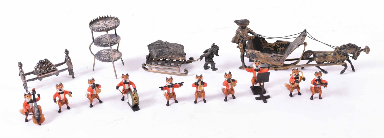 Ten Bronze Cold Painted Fox Musicians: Together with a 800 silver miniature dwarf pulling a sled. Rock atop of the sled may be fool's gold. Also including a miniature men carrying a load of cannonballs, marked 22., a miniature unmarked tab